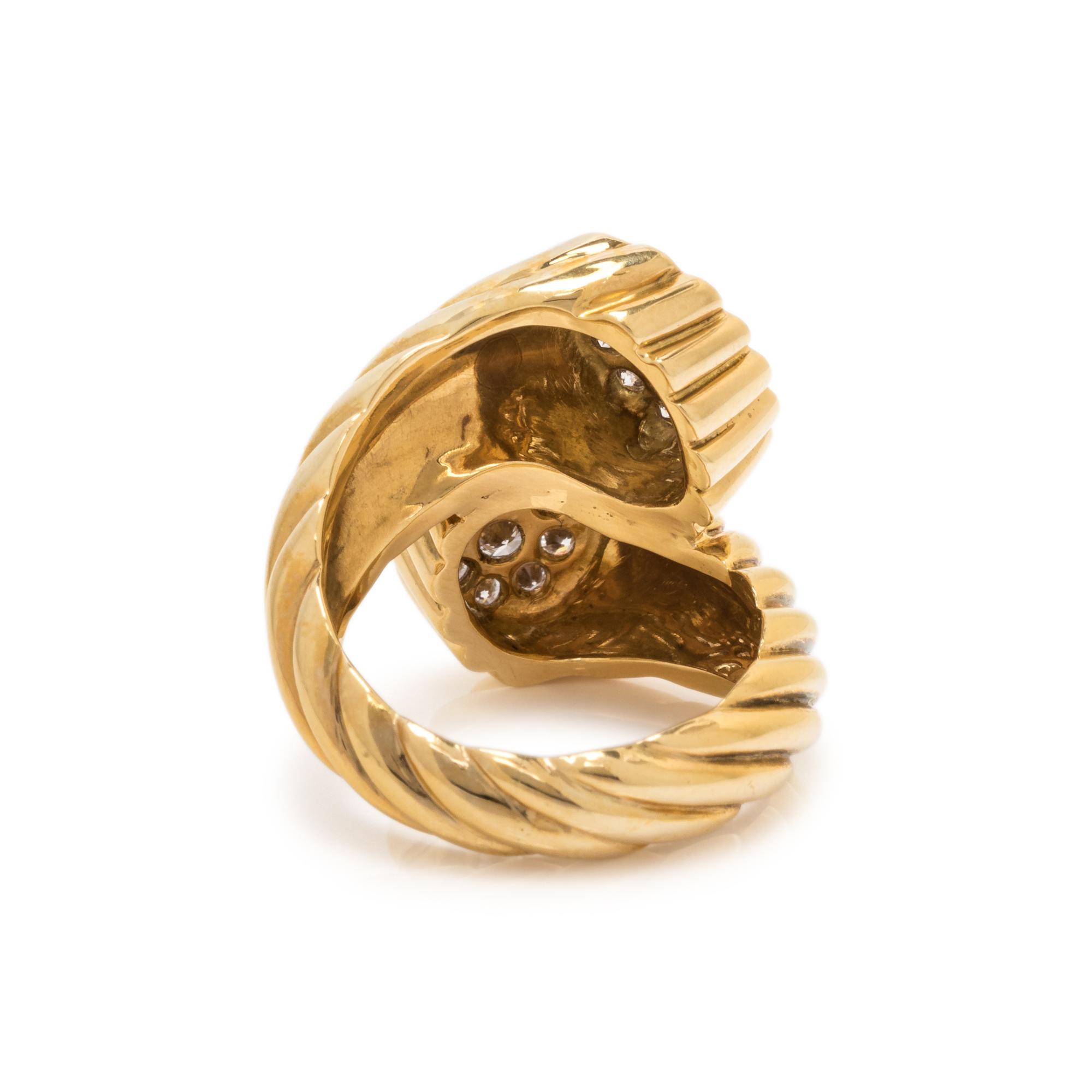 SCHLUGER, YELLOW GOLD AND DIAMOND BYPASS RING