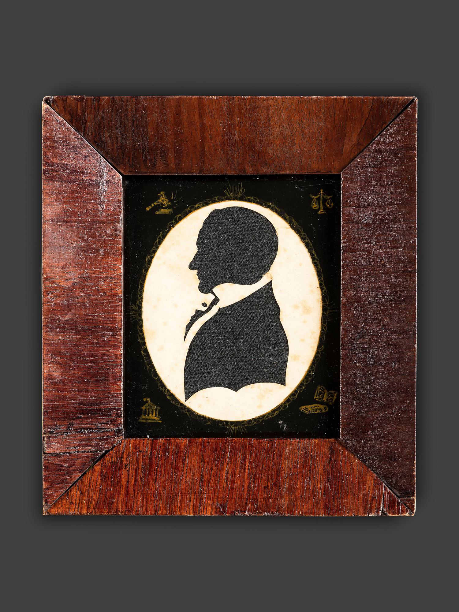 A Cut Paper and Cloth Silhouette of Enoch Titcomb with Eglomise Mat