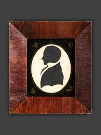 A Cut Paper and Cloth Silhouette of Enoch Titcomb with Eglomise Mat