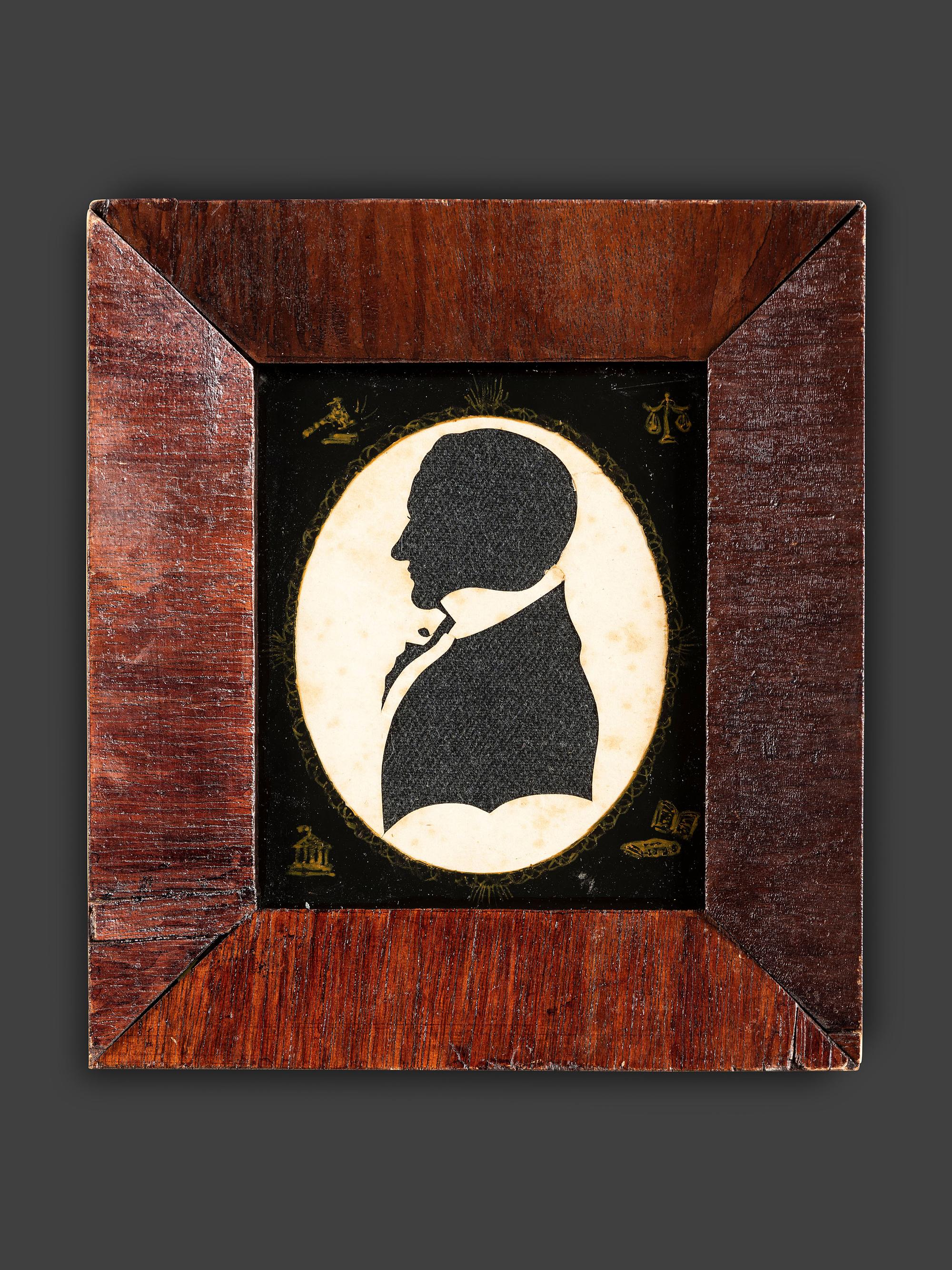A Cut Paper and Cloth Silhouette of Enoch Titcomb with Eglomise Mat