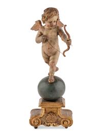 A Continental Painted and Parcel Gilt Cherub Ornament