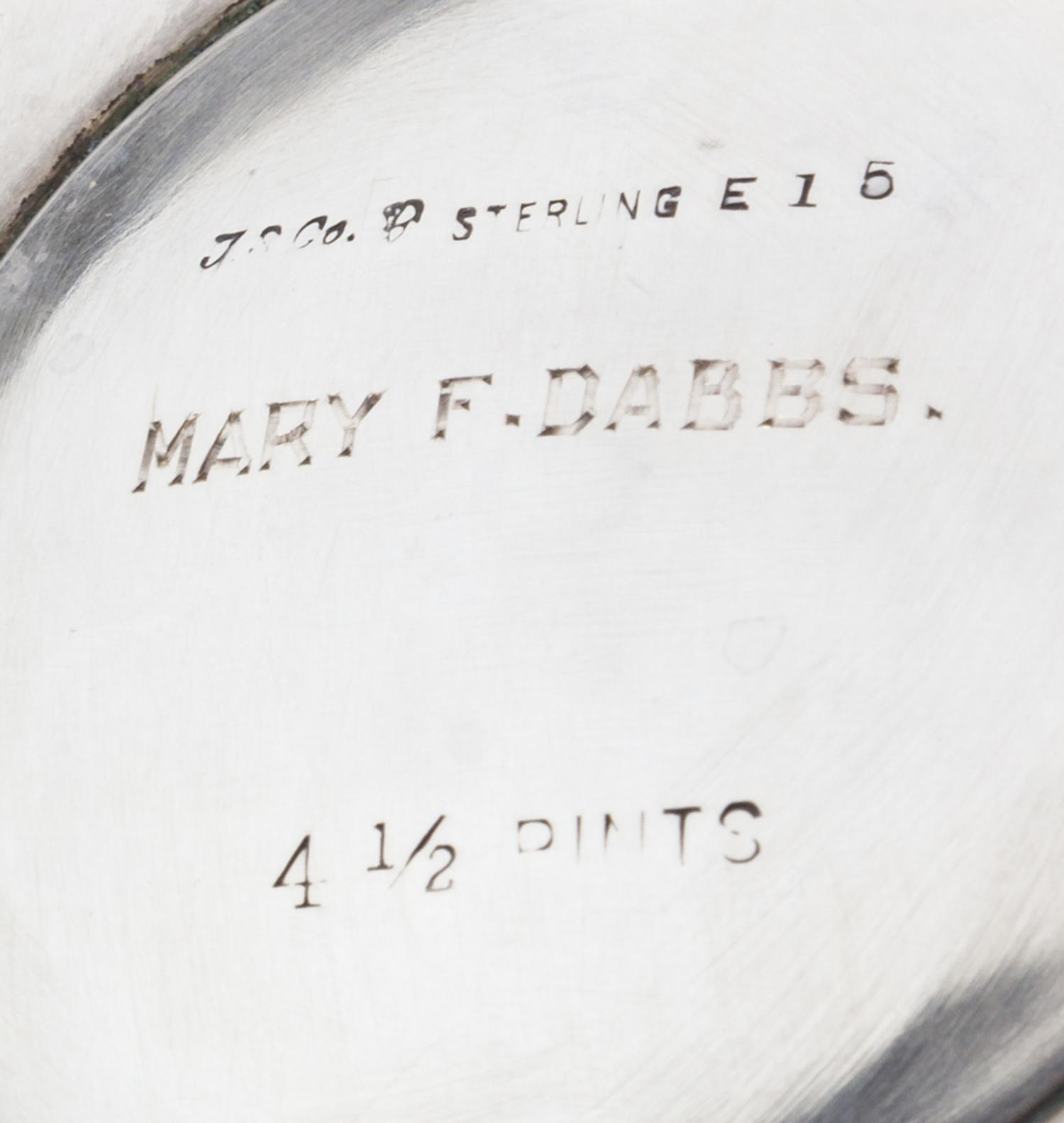 An American Silver Water Pitcher, International Silver Co., Meriden, CT, the paneled tapering body raised on an octagonal foot.