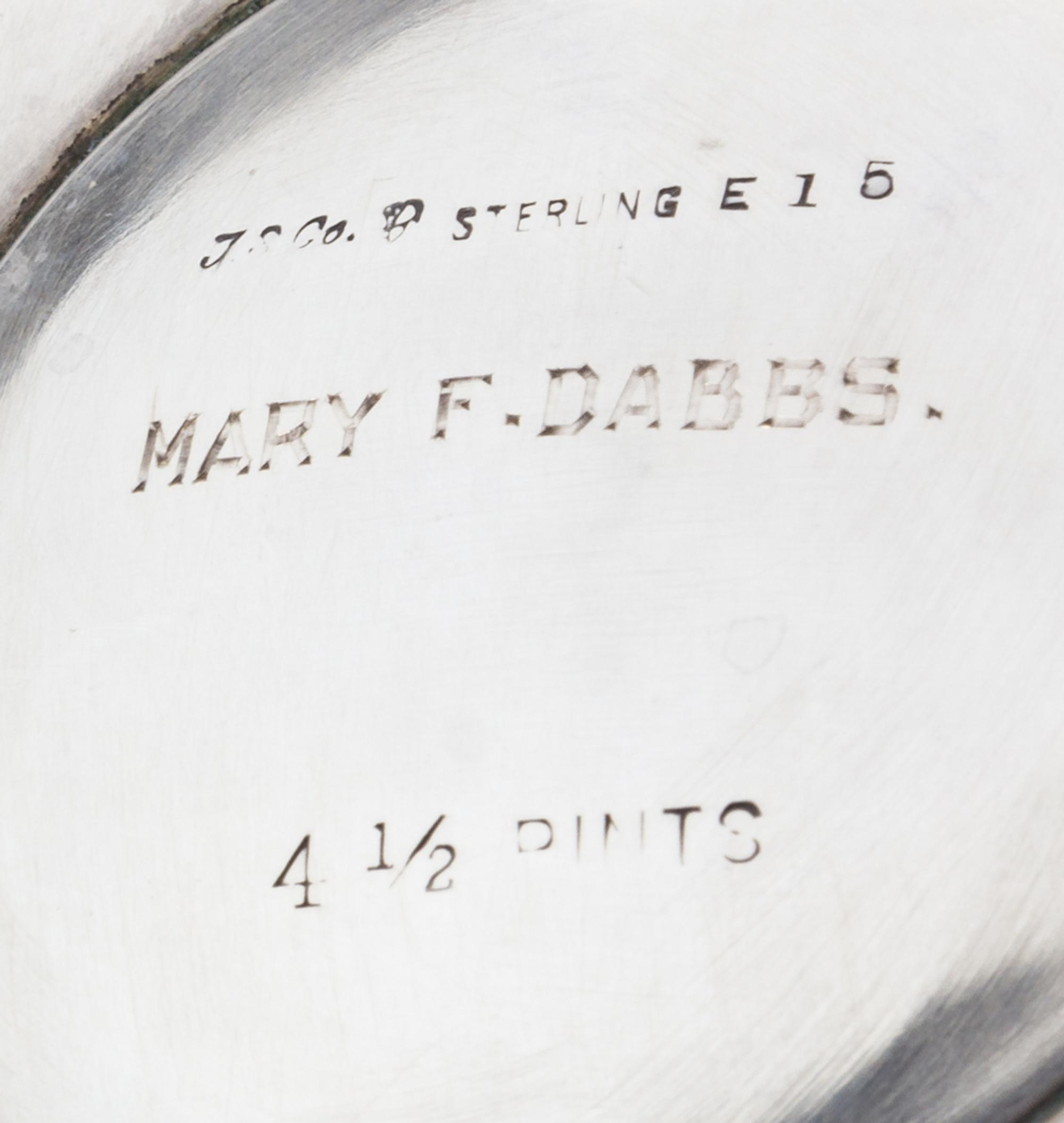 An American Silver Water Pitcher, International Silver Co., Meriden, CT, the paneled tapering body raised on an octagonal foot.