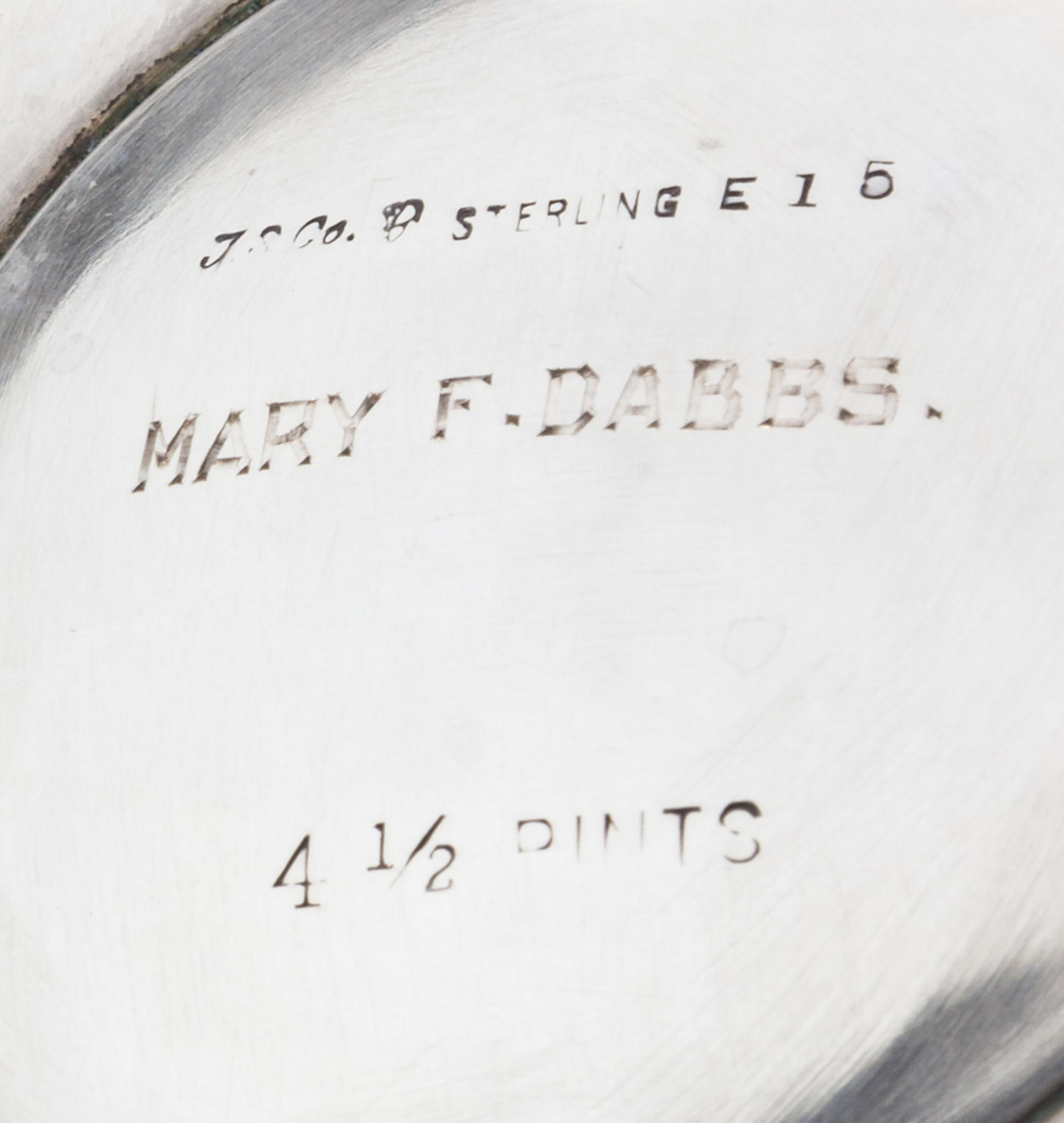 An American Silver Water Pitcher, International Silver Co., Meriden, CT, the paneled tapering body raised on an octagonal foot.