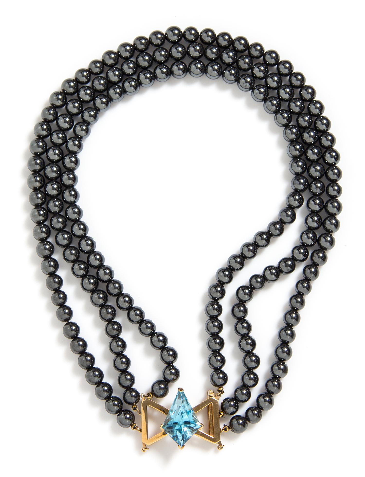 A 14 Karat Yellow Gold, Multi Strand Hematite and Topaz Necklace,