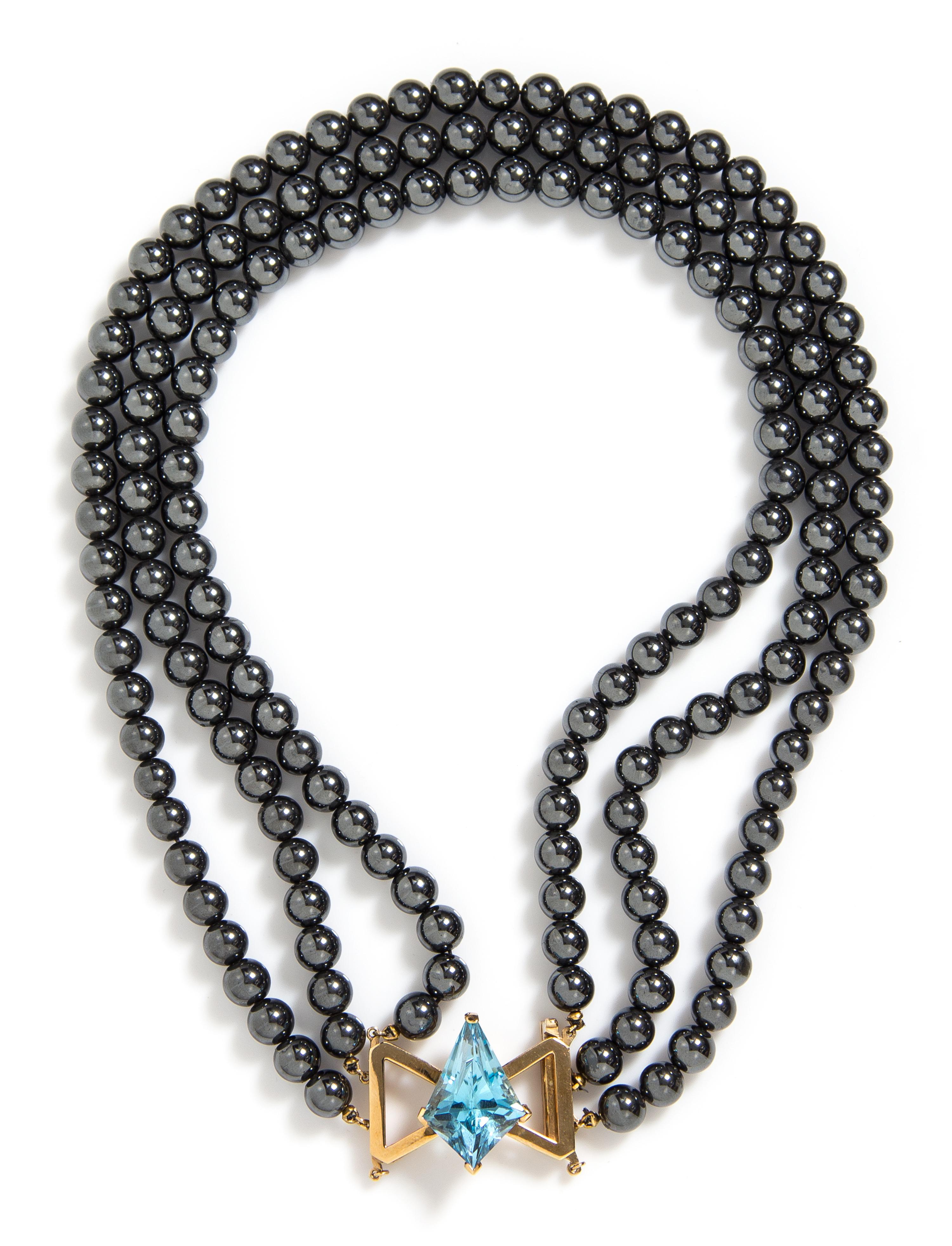 A 14 Karat Yellow Gold, Multi Strand Hematite and Topaz Necklace,
