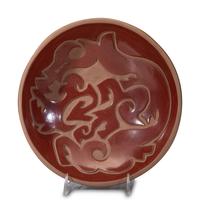 Carved Redware Pottery Charger, with Avanyu