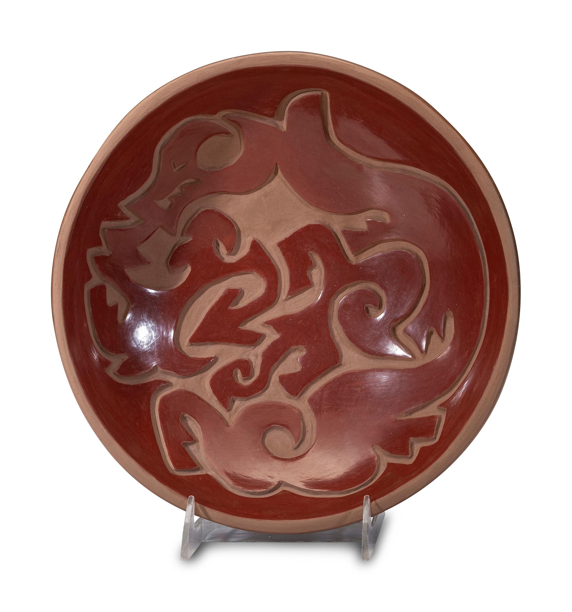 Carved Redware Pottery Charger, with Avanyu