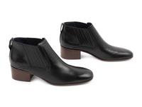 Three Pairs of Designer Boots: One Chanel, One Prada, One Celine