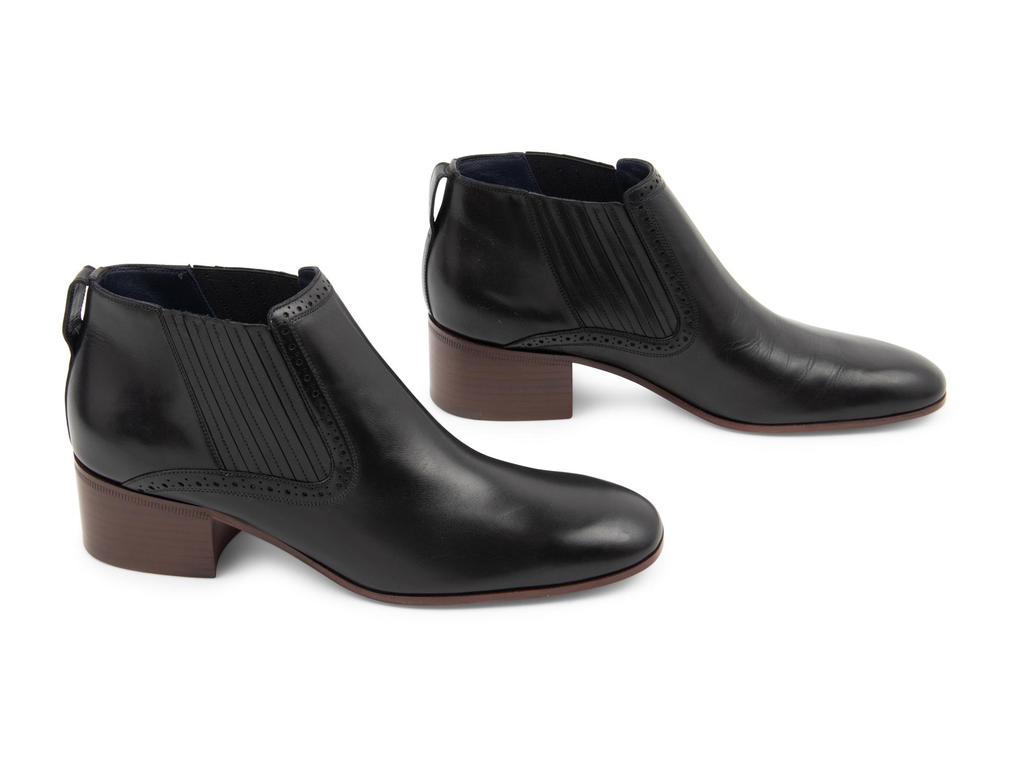 Three Pairs of Designer Boots: One Chanel, One Prada, One Celine
