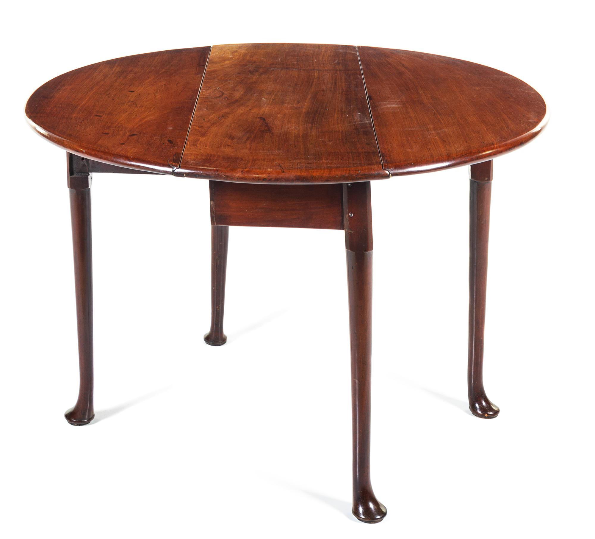 A George II Mahogany Drop-Leaf Table Height 27 1/2 x width 36 x depth 14 1/2 inches (closed). — MID-18TH CENTURY