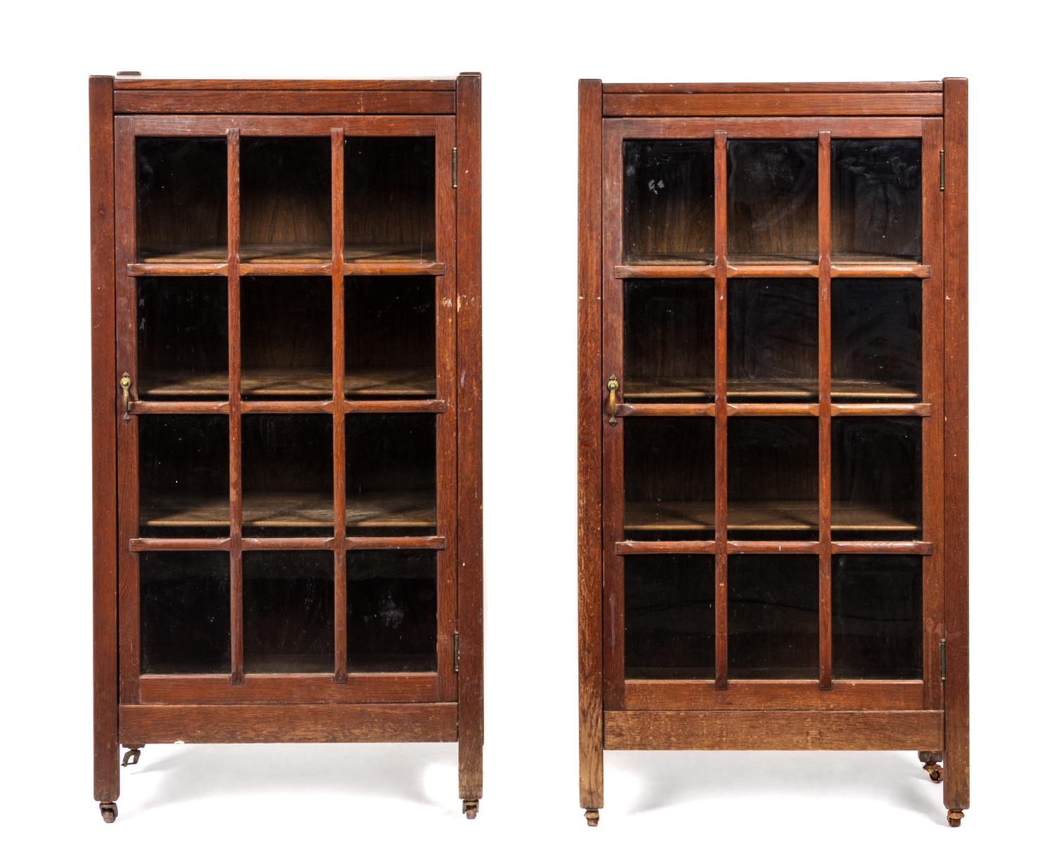 A Pair of Arts and Crafts Oak Bookcases Height 49 x width 25 1/2 x depth 12 1/2 inches.