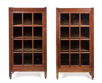 A Pair of Arts and Crafts Oak Bookcases Height 49 x width 25 1/2 x depth 12 1/2 inches.