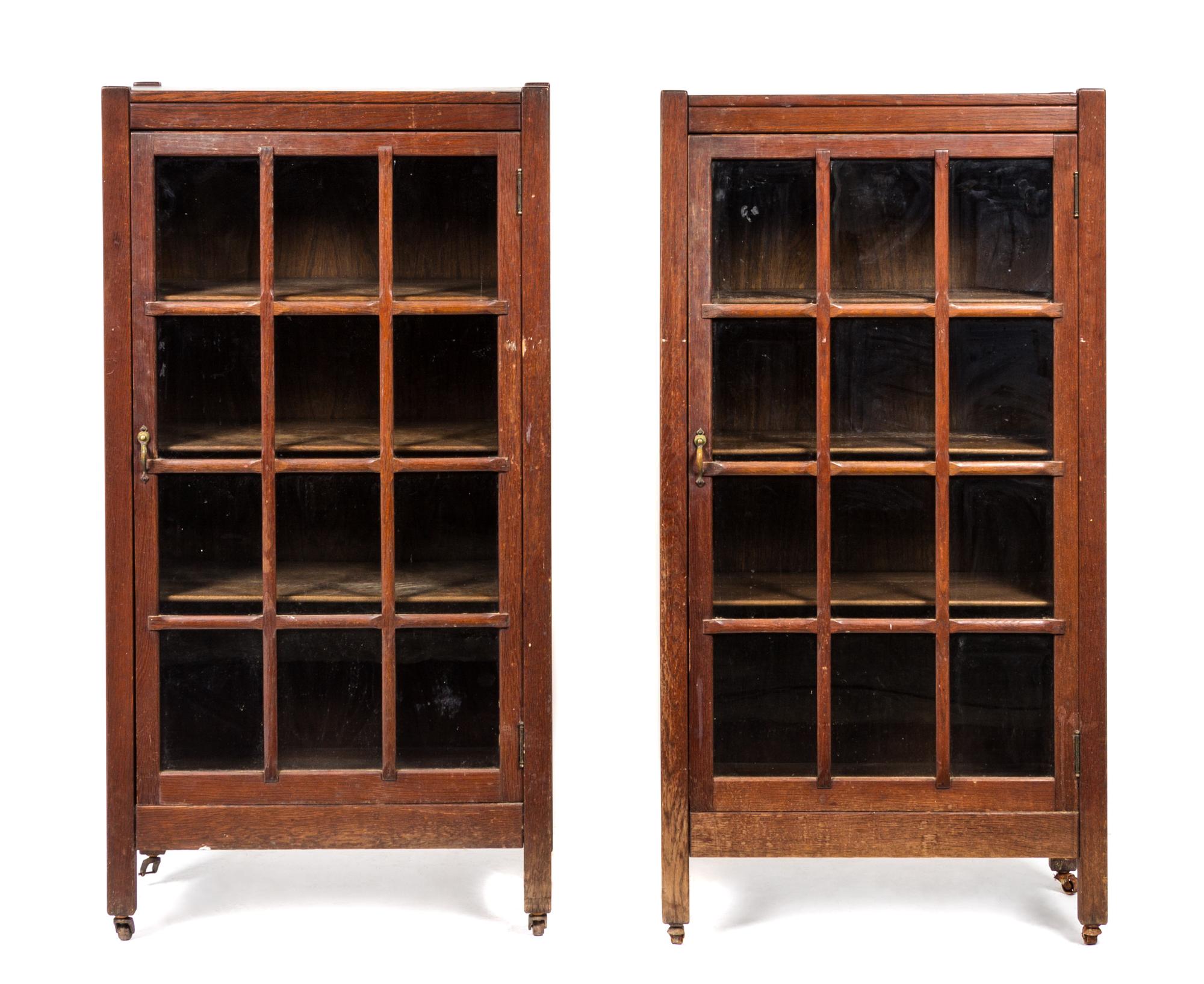 A Pair of Arts and Crafts Oak Bookcases Height 49 x width 25 1/2 x depth 12 1/2 inches.