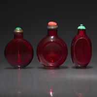 Three Chinese Ruby Glass Snuff Bottles, 18th Century and Later — 清中期及以後 寶石紅料鼻煙壺三支