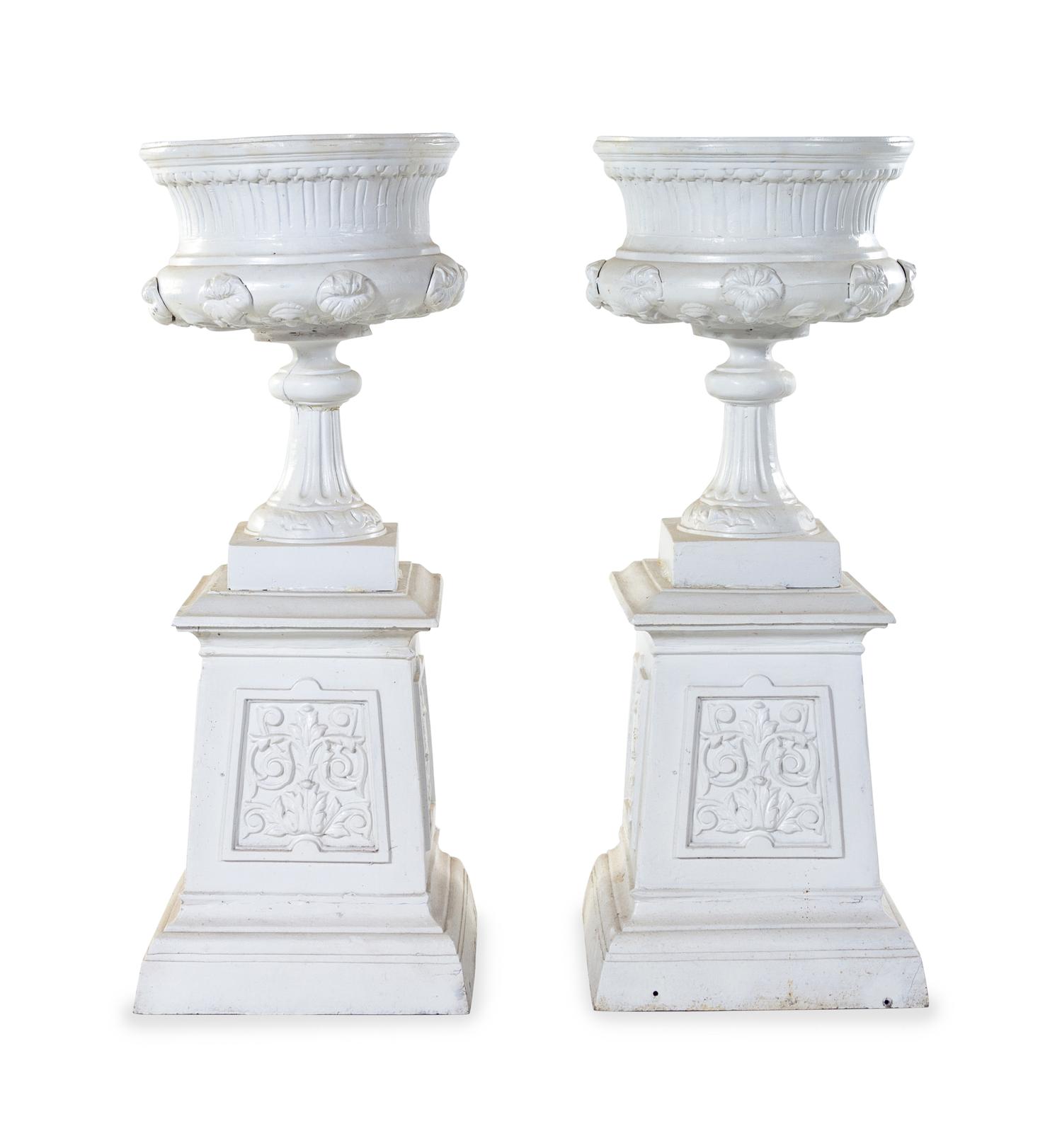 A Pair of Painted Iron Garden Urns