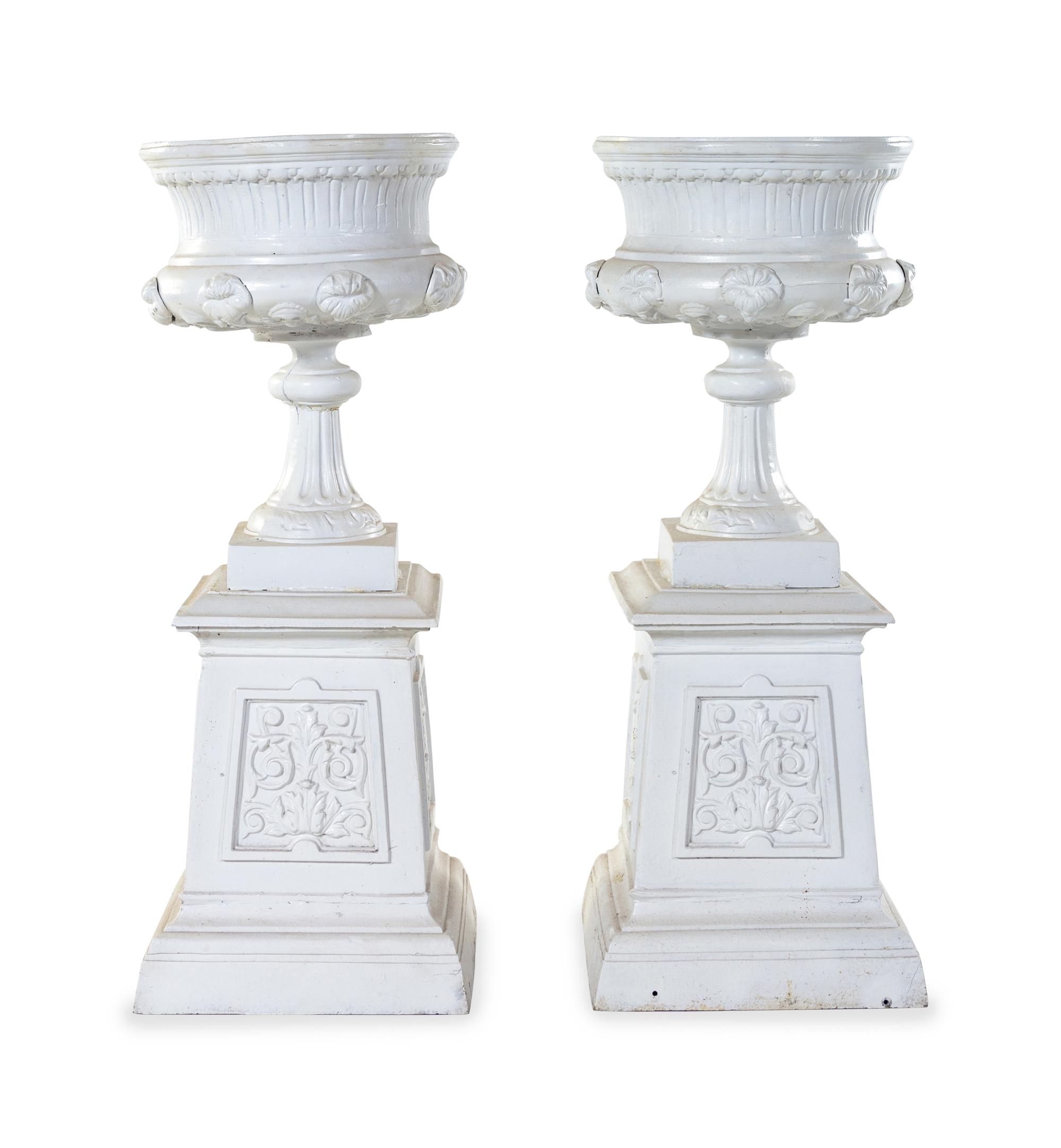 A Pair of Painted Iron Garden Urns