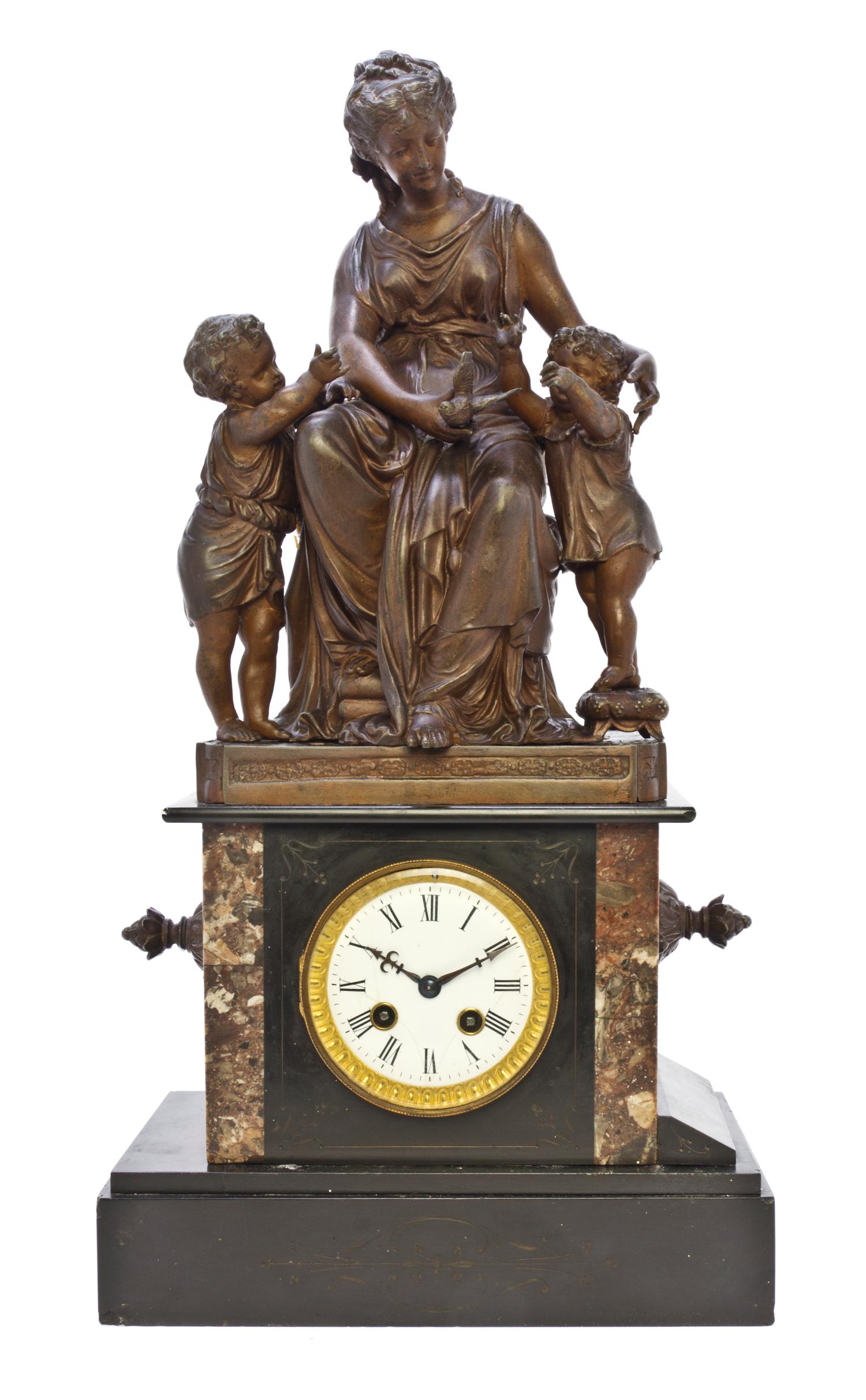 A French Cast Metal and Slate Figural Mantel Clock, Height 22 1/4 inches.