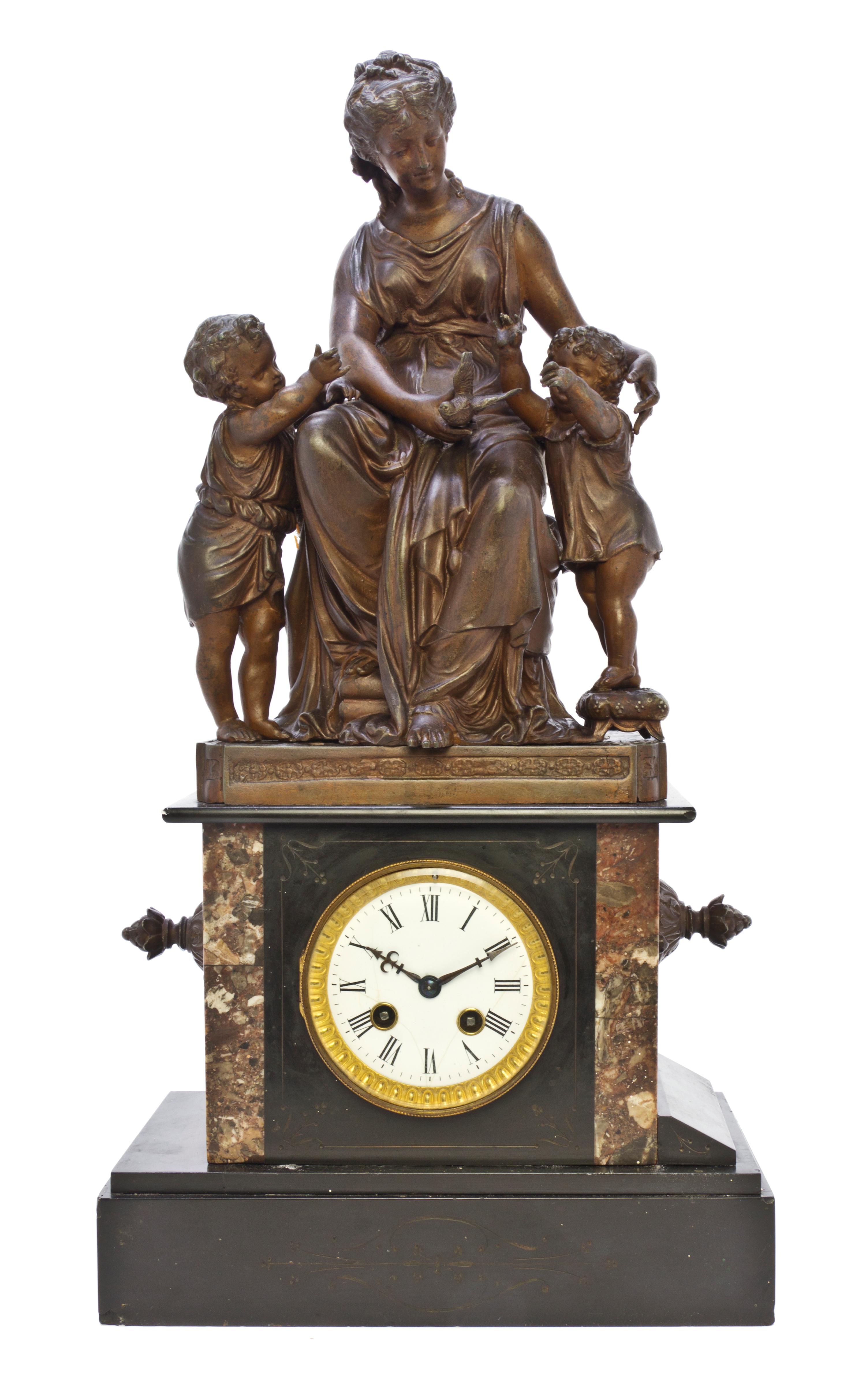A French Cast Metal and Slate Figural Mantel Clock, Height 22 1/4 inches.