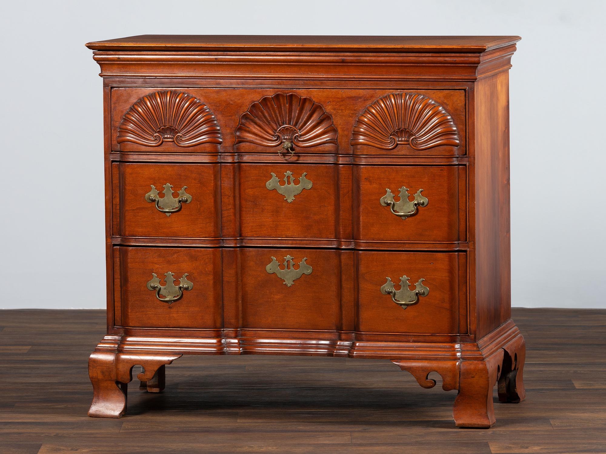 A Chippendale Shell-and-Block Carved Cherrywood Chest of Drawers
