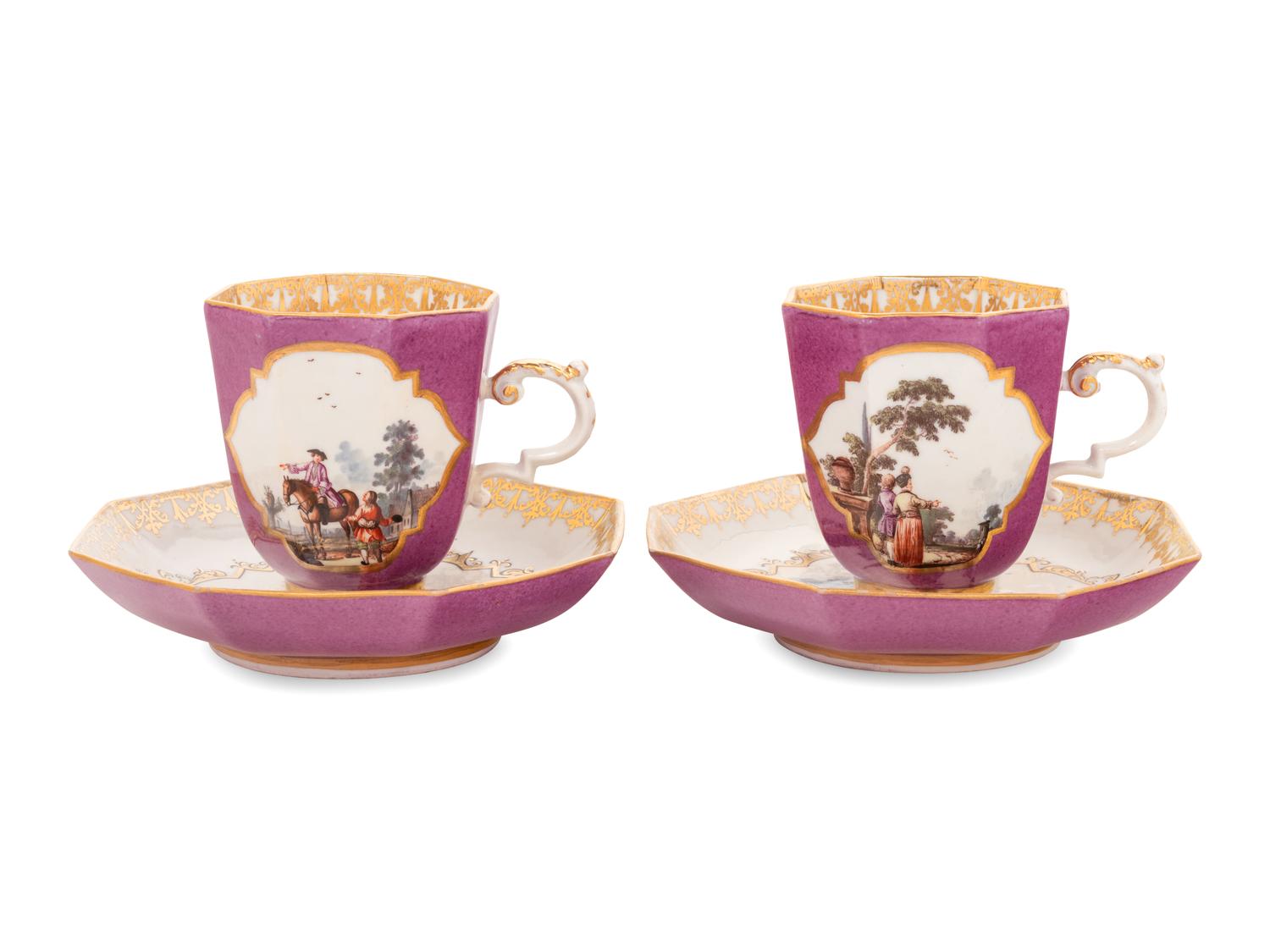 A Pair of Meissen Magenta-Ground Scenic Porcelain Teacups and Saucers
