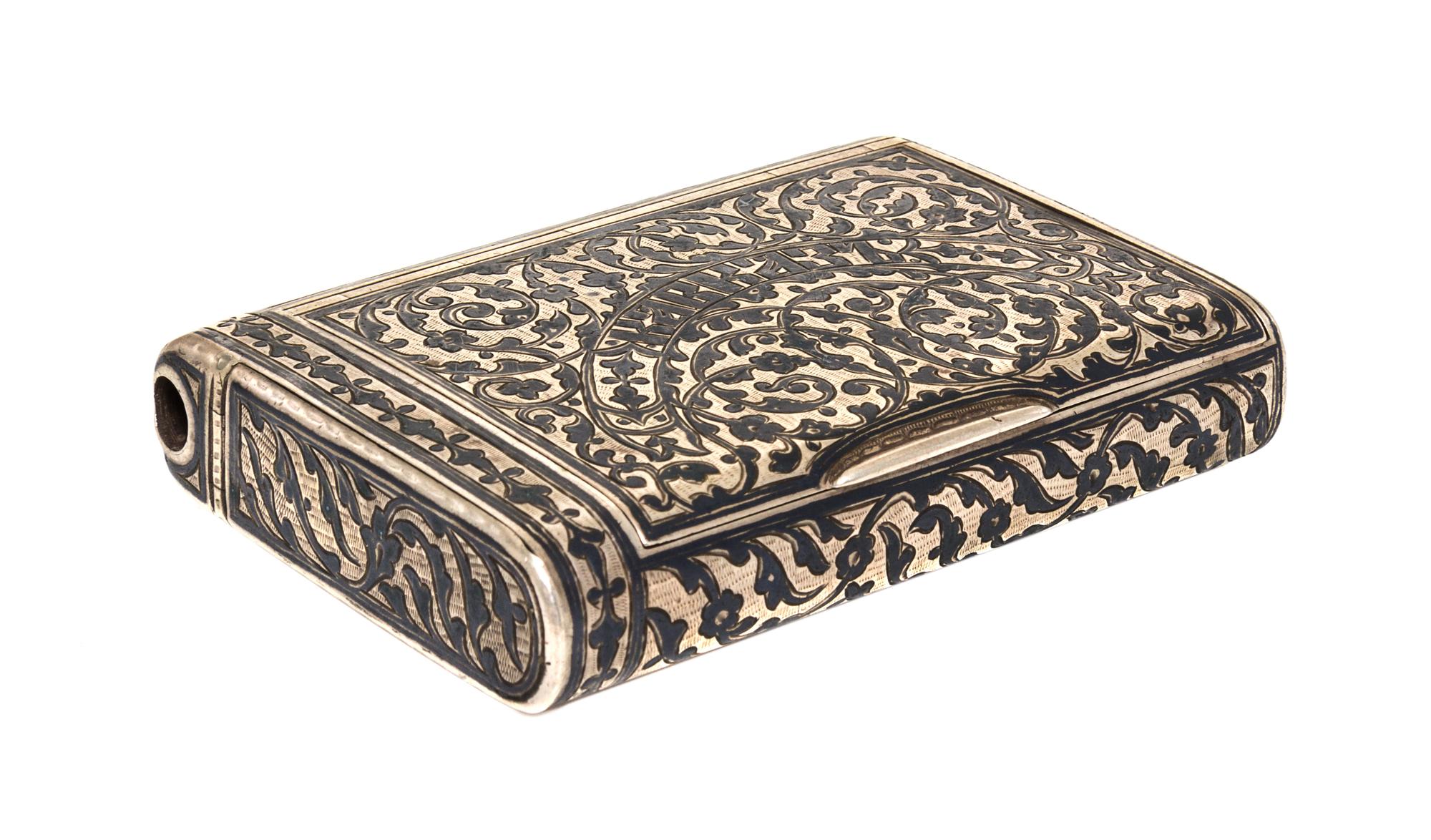 A Russian Niello Silver Cigarette Case, Moicye or Maxim Ivanov, 1896-1908, of rectangular form, the lid centered with Cyrillic script o