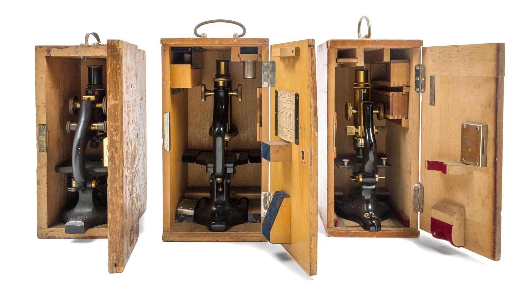 Three Brass and Black Lacquered Microscopes Height of tallest case 13 1/2 inches. — LEITZ, LATE 19TH CENTURY AND OTHERS