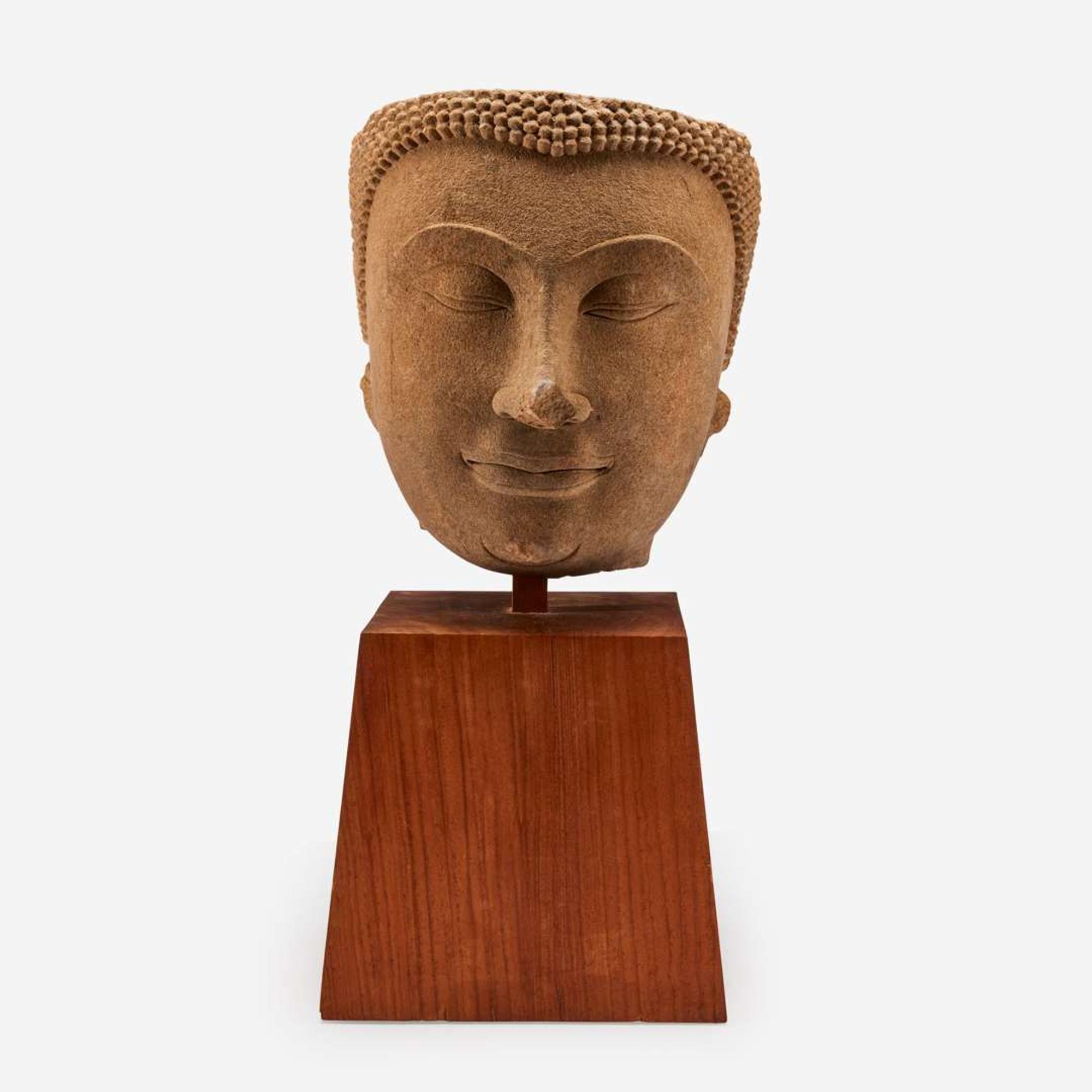 A large Thai carved sandstone head of a Buddha泰国石雕佛首