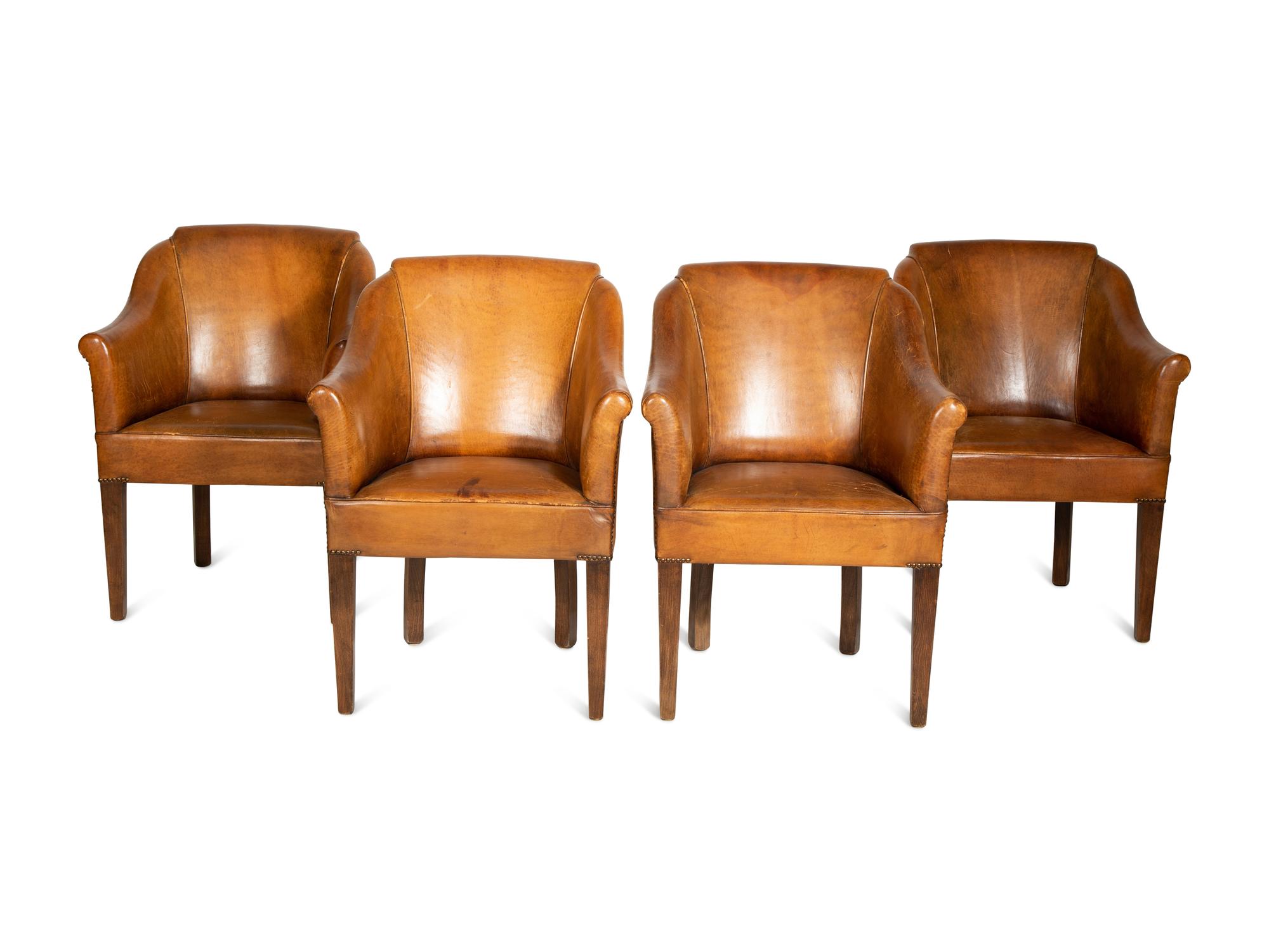 A Set of Four Leather-Upholstered Barrel-Back Armchairs