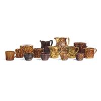 A Group of Fourteen Bennington or Rockingham Glazed Earthenware Items