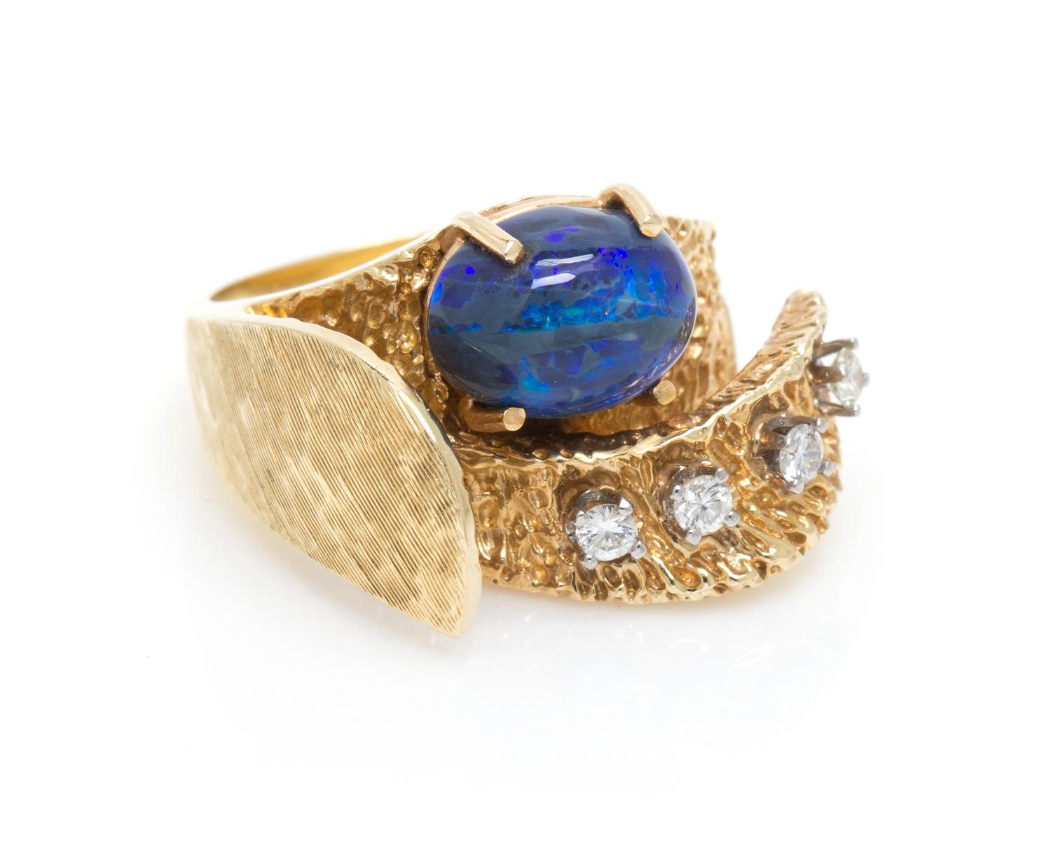 A 14 Karat Yellow Gold, Opal and Diamond Ring, 7.50 dwts.