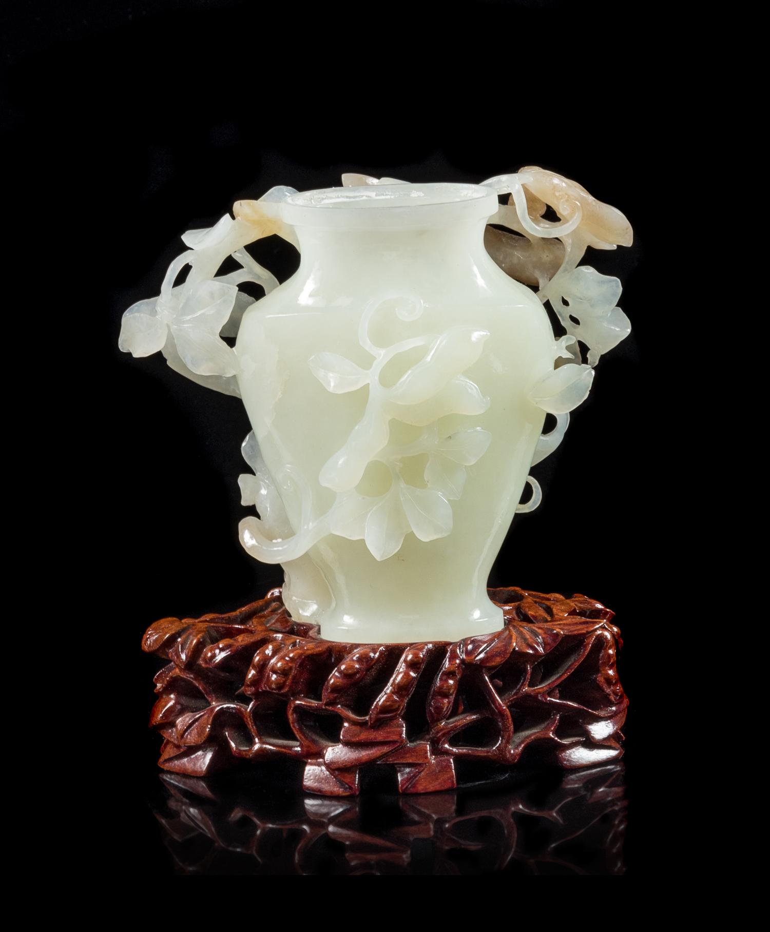 A Chinese White and Russet Jade Vase