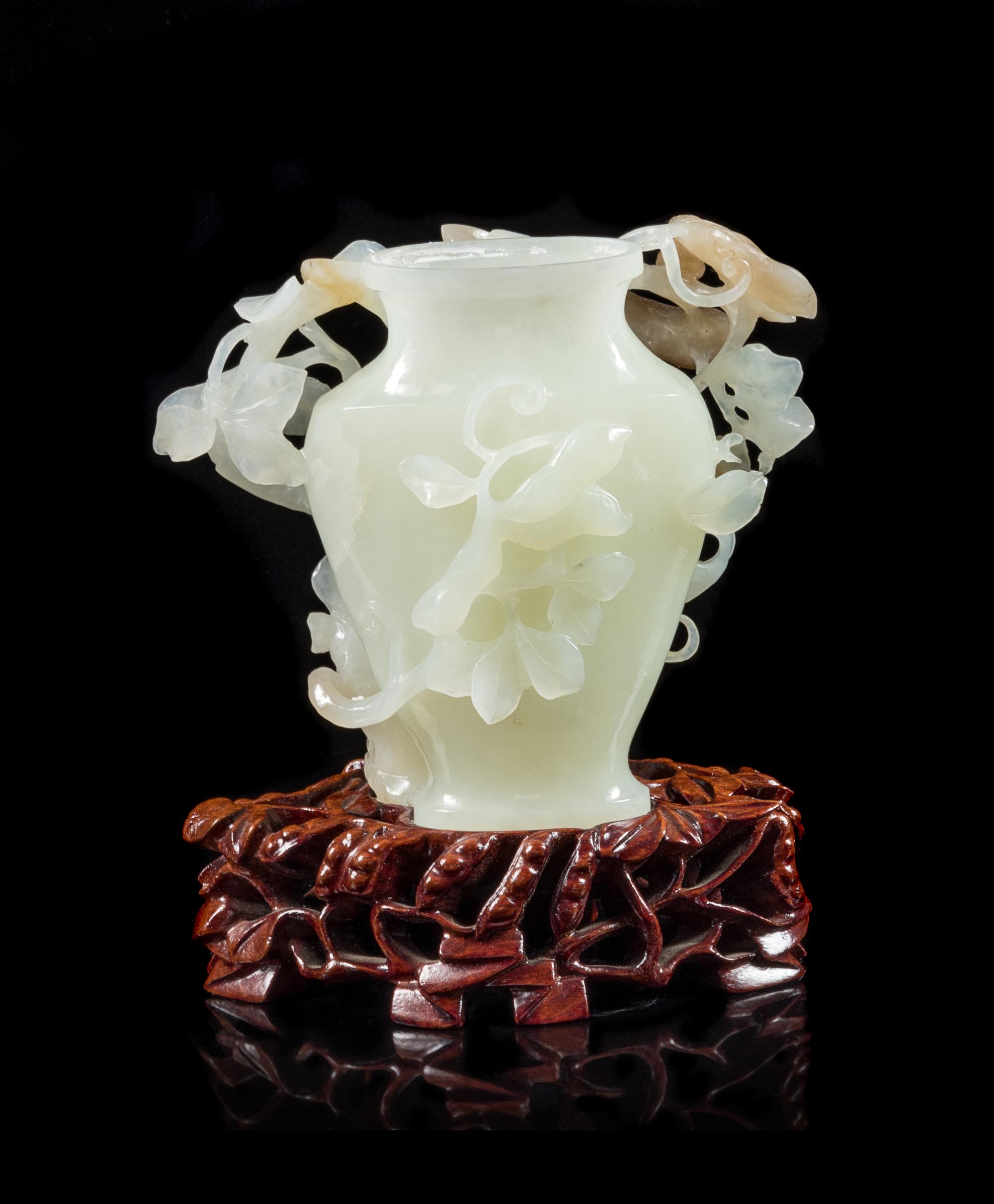 A Chinese White and Russet Jade Vase