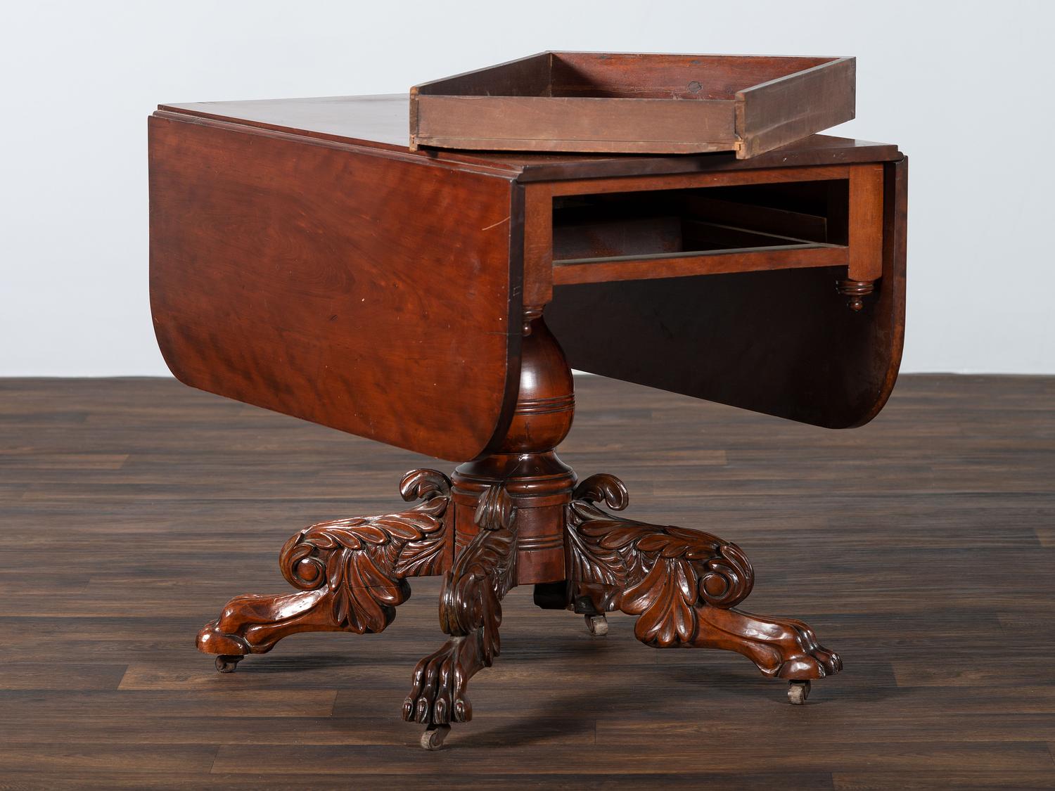 A Classical Highly Carved Cherrywood Drop-Leaf Dining Table