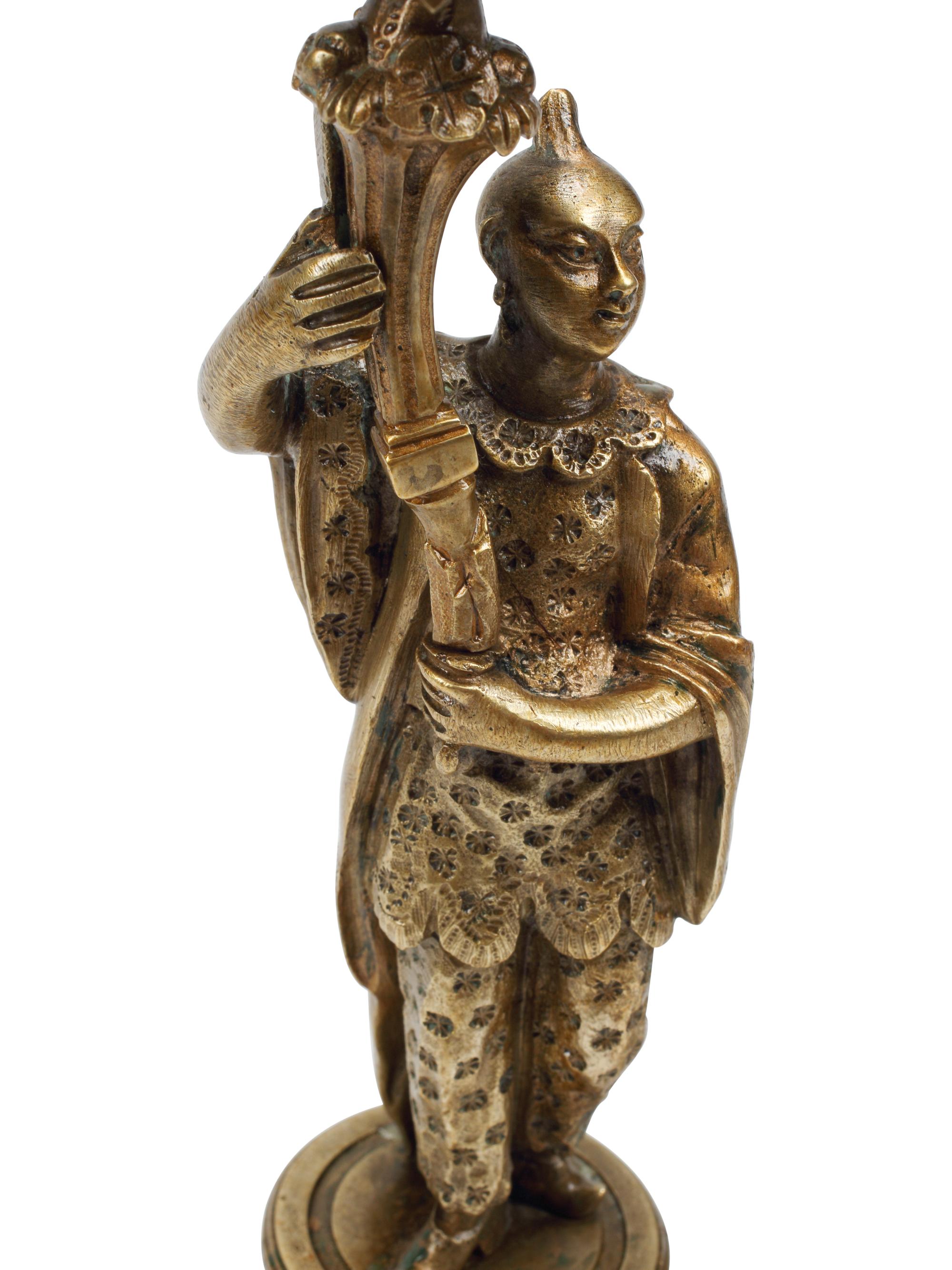 A Pair of French Bronze Figural Candlesticks on Marble Bases