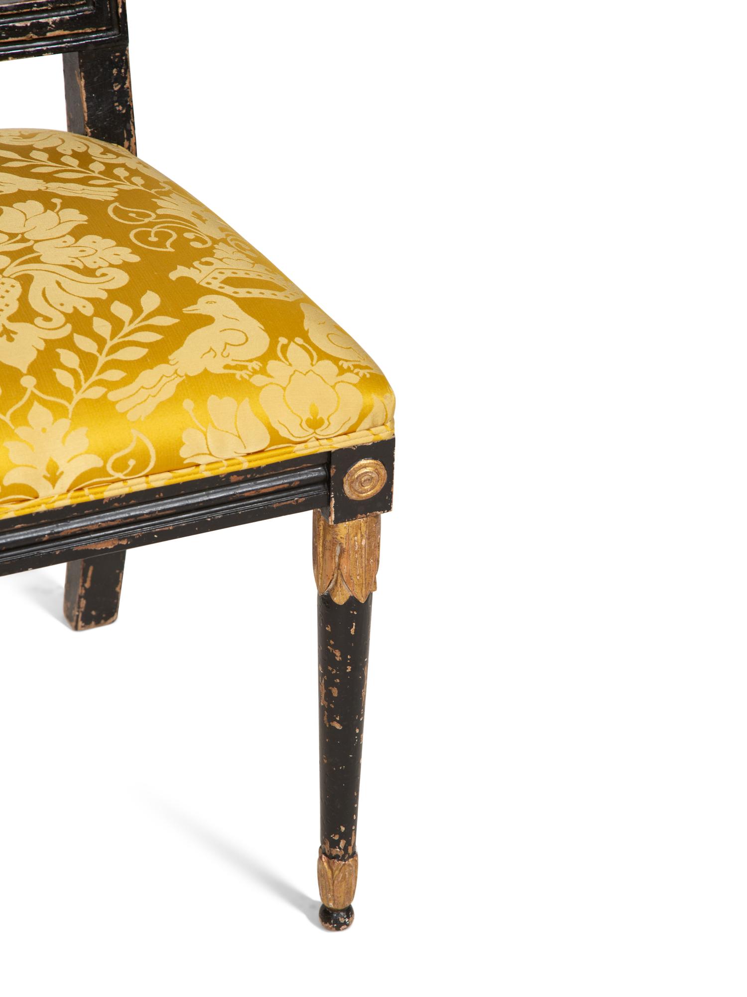 A Pair of Italian Ebonized and Parcel Gilt Side Chairs with Scalamandré Upholstered Seats