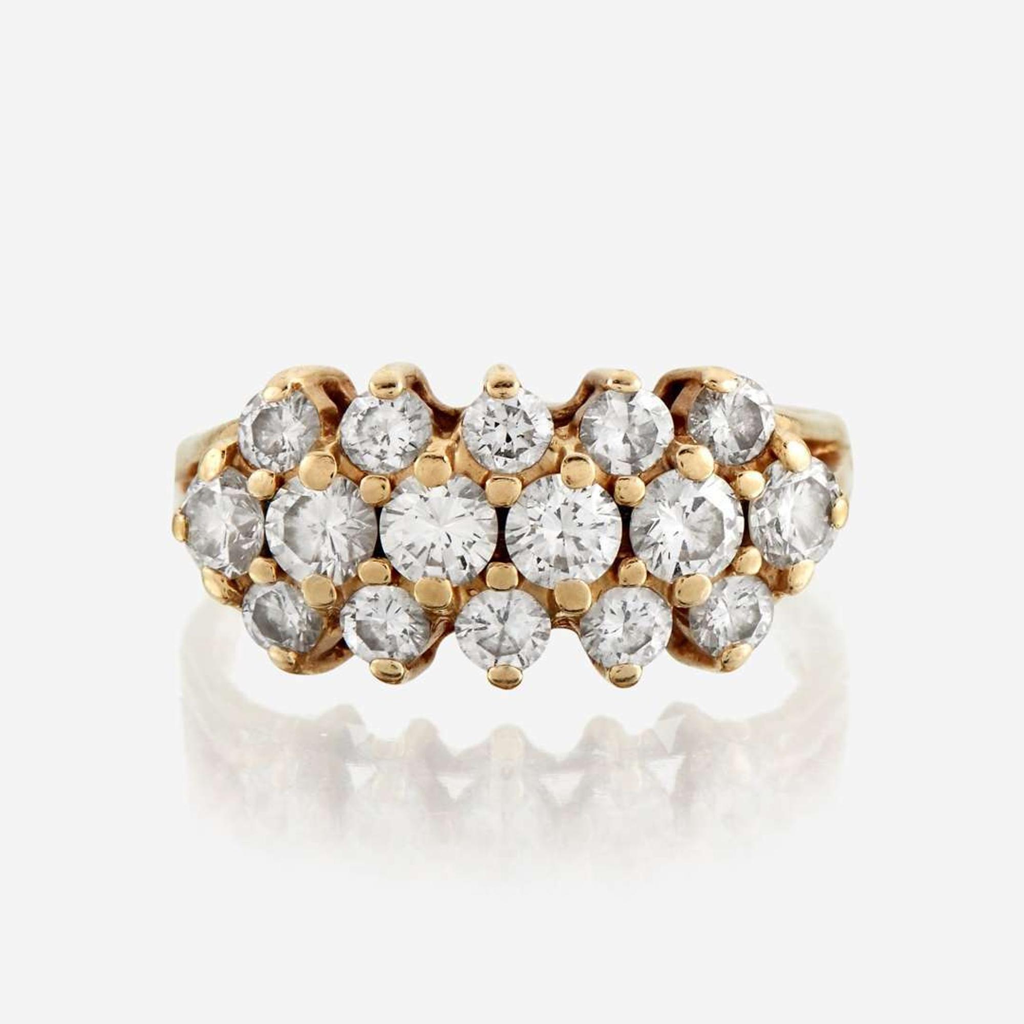 A diamond and fourteen karat gold ring