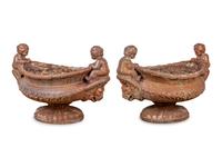 A Pair of Case Iron Oval Footed Planters with Cherub Handles — 20TH CENTURY