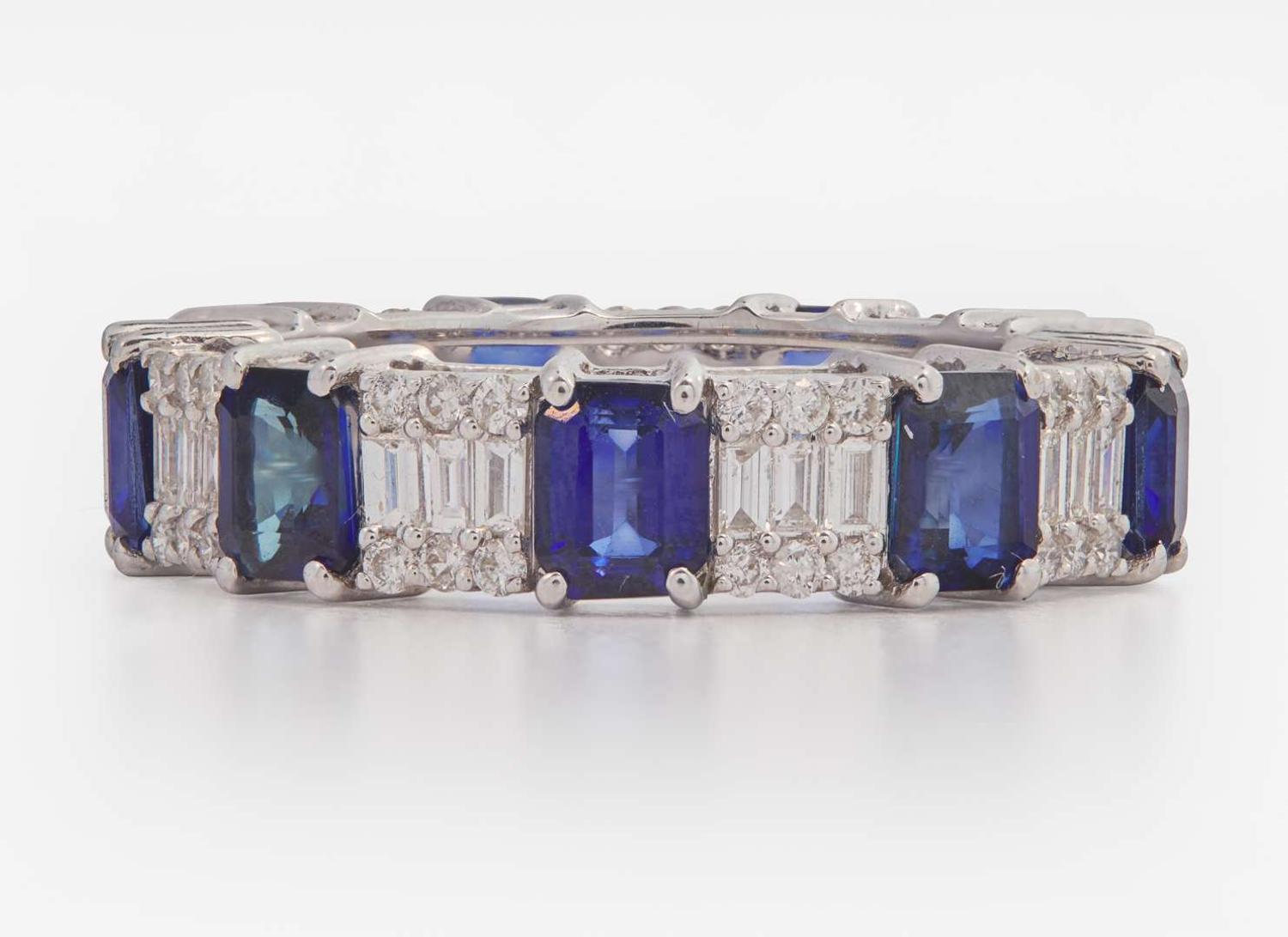 An 18K White Gold, Sapphire, and Diamond Eternity Band