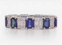An 18K White Gold, Sapphire, and Diamond Eternity Band