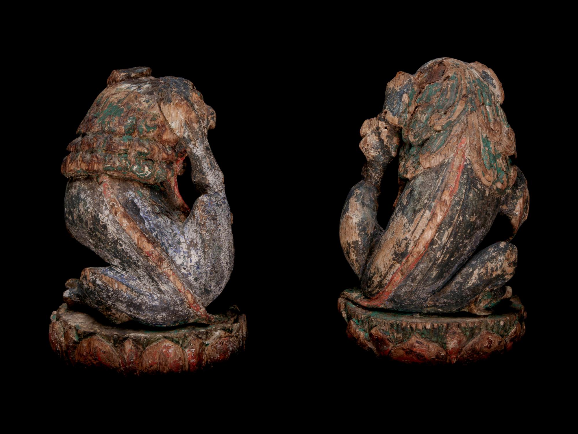 A Pair of Chinese Polychrome Painted Wood Figures of Fu Lions