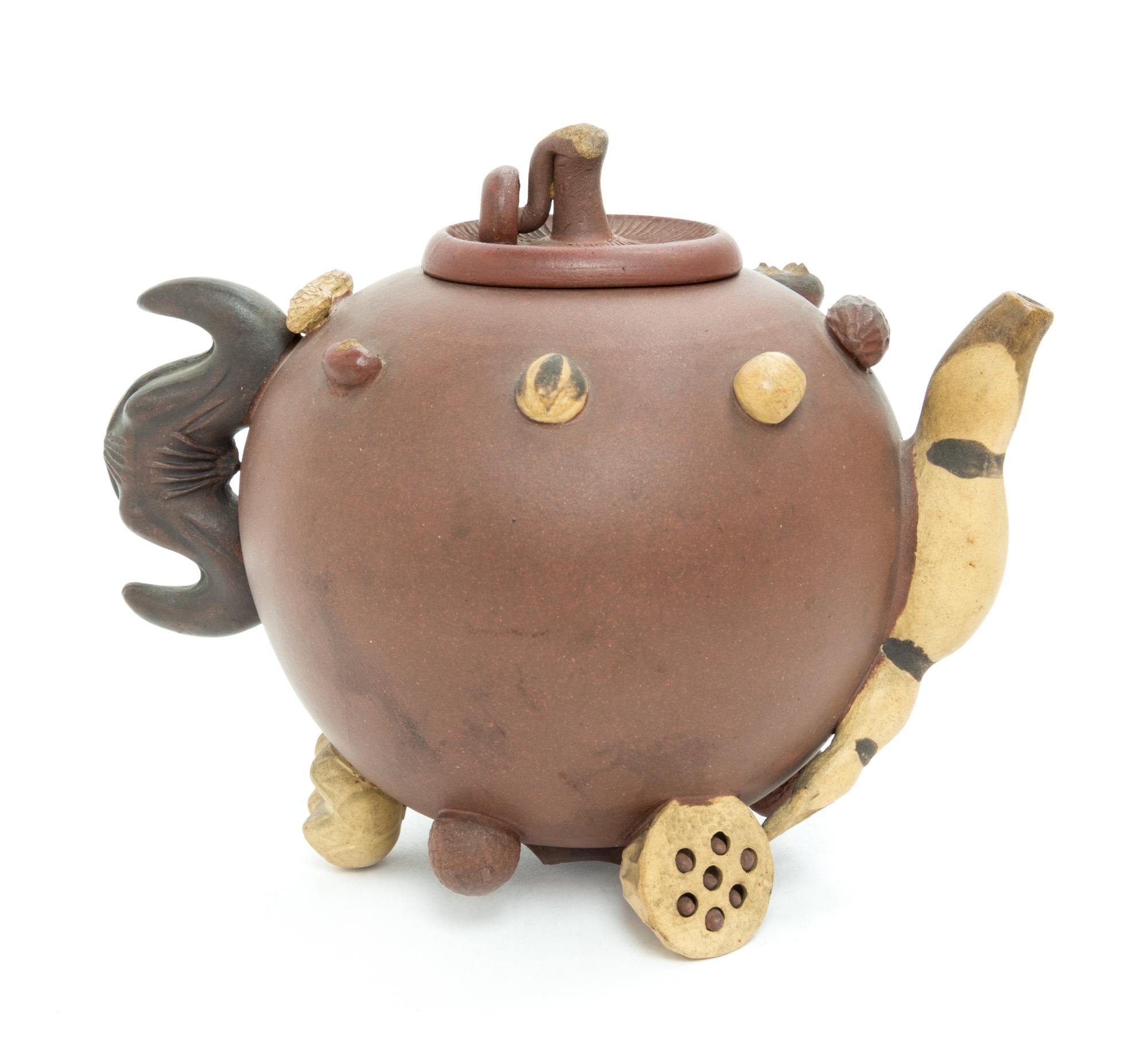 A Chinese Yixing Pottery Teapot Height 5 1/2 inches. — 20TH CENTURY