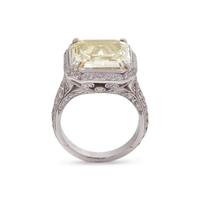 AN IMPRESSIVE FANCY YELLOW DIAMOND AND DIAMOND RING