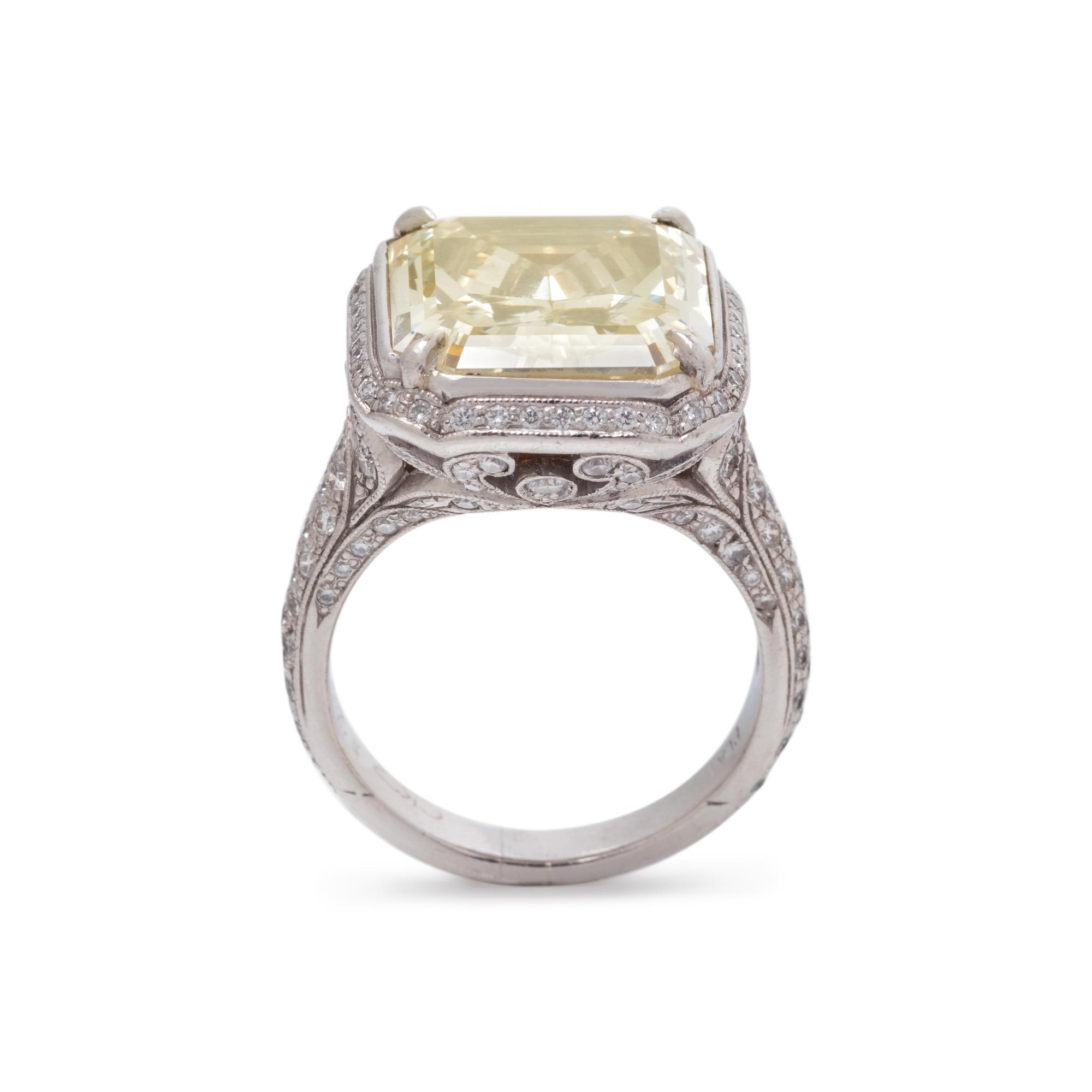 AN IMPRESSIVE FANCY YELLOW DIAMOND AND DIAMOND RING