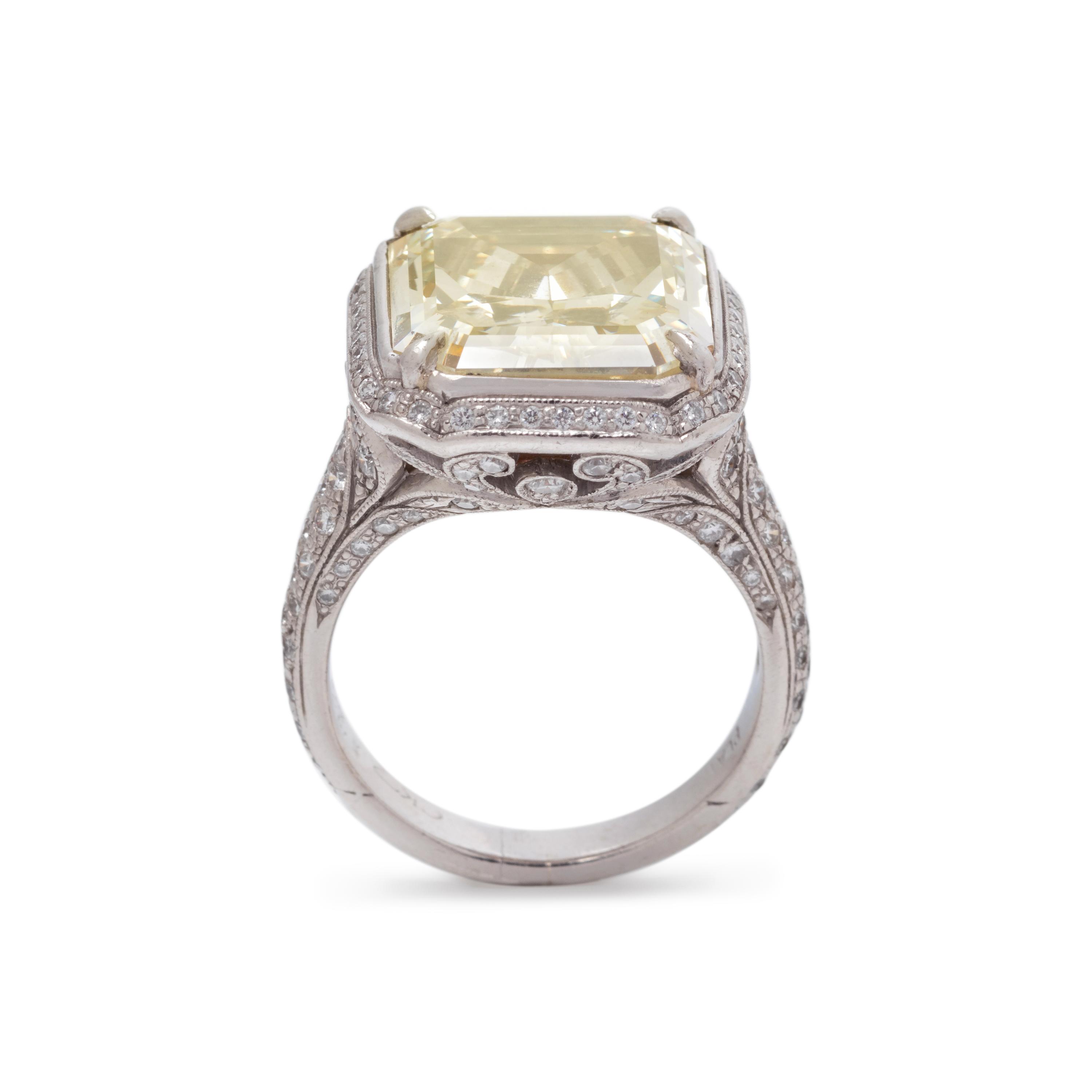 AN IMPRESSIVE FANCY YELLOW DIAMOND AND DIAMOND RING
