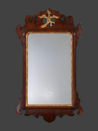 A Chippendale Carved and Parcel Gilt Mahogany Eagle-Decorated Looking Glass