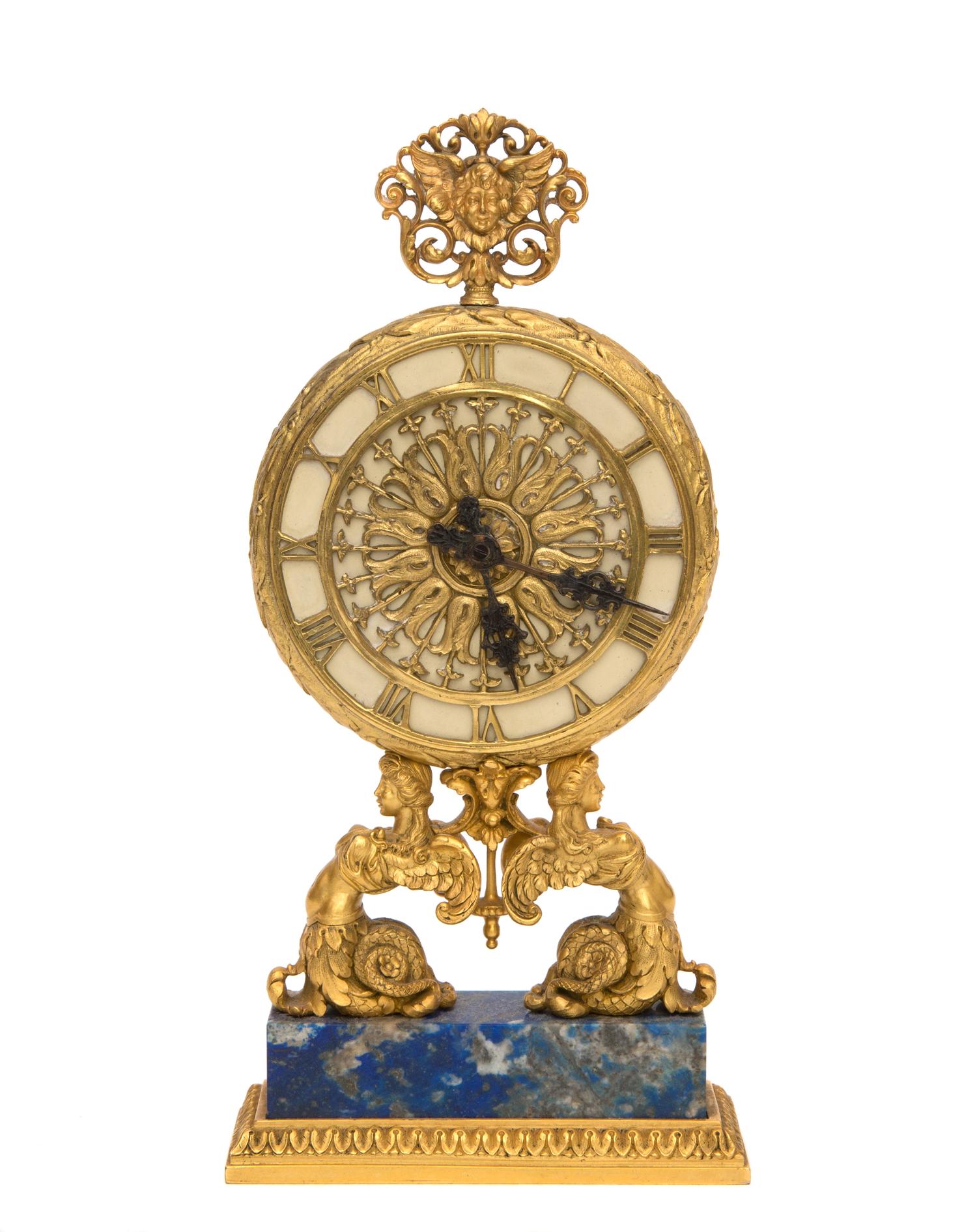 A Continental Gilt Bronze Table Clock Height 8 inches. — RETAILED BY E. F. CALDWELL, NEW YORK