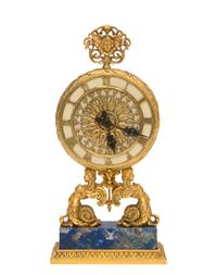 A Continental Gilt Bronze Table Clock Height 8 inches. — RETAILED BY E. F. CALDWELL, NEW YORK
