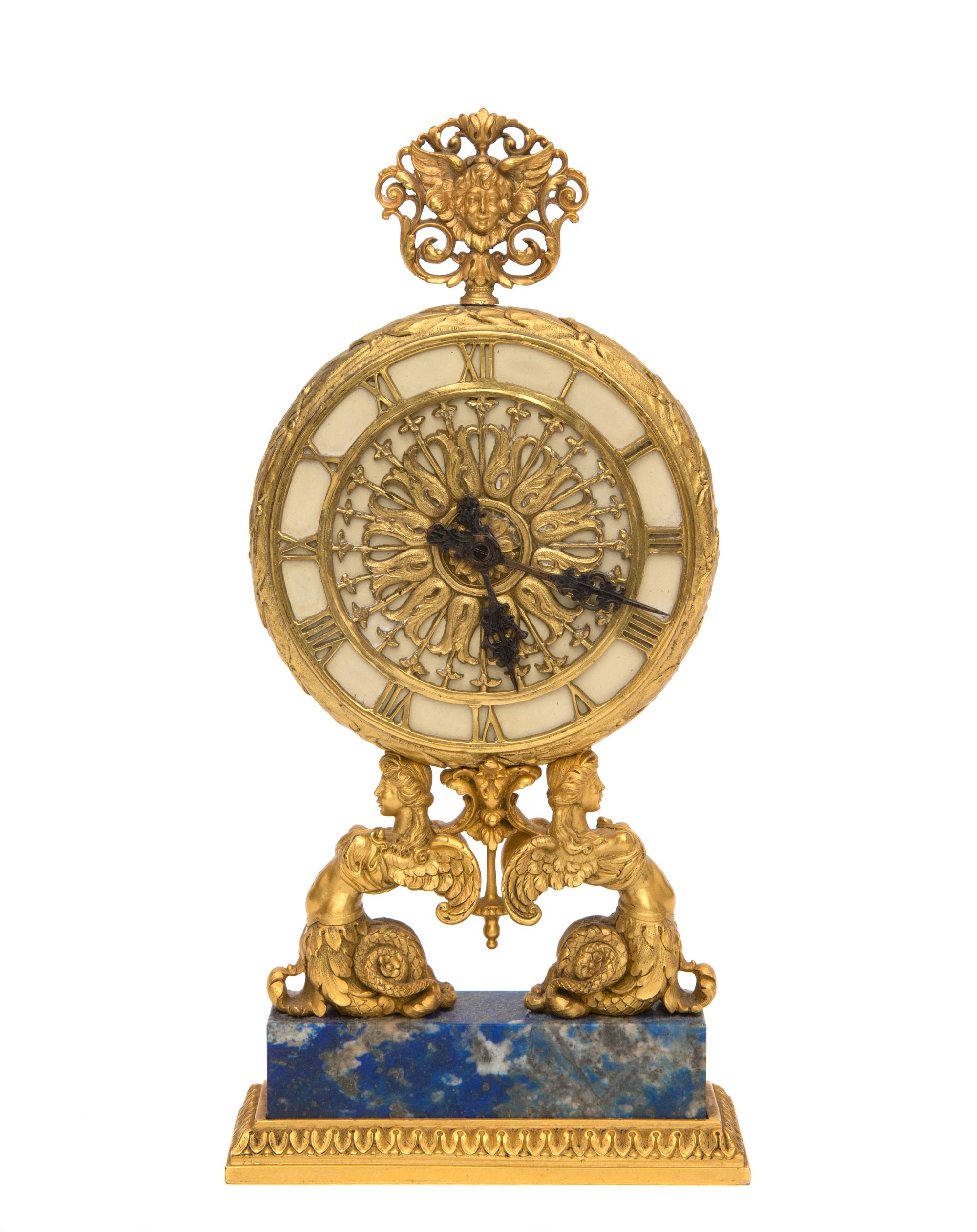 A Continental Gilt Bronze Table Clock Height 8 inches. — RETAILED BY E. F. CALDWELL, NEW YORK