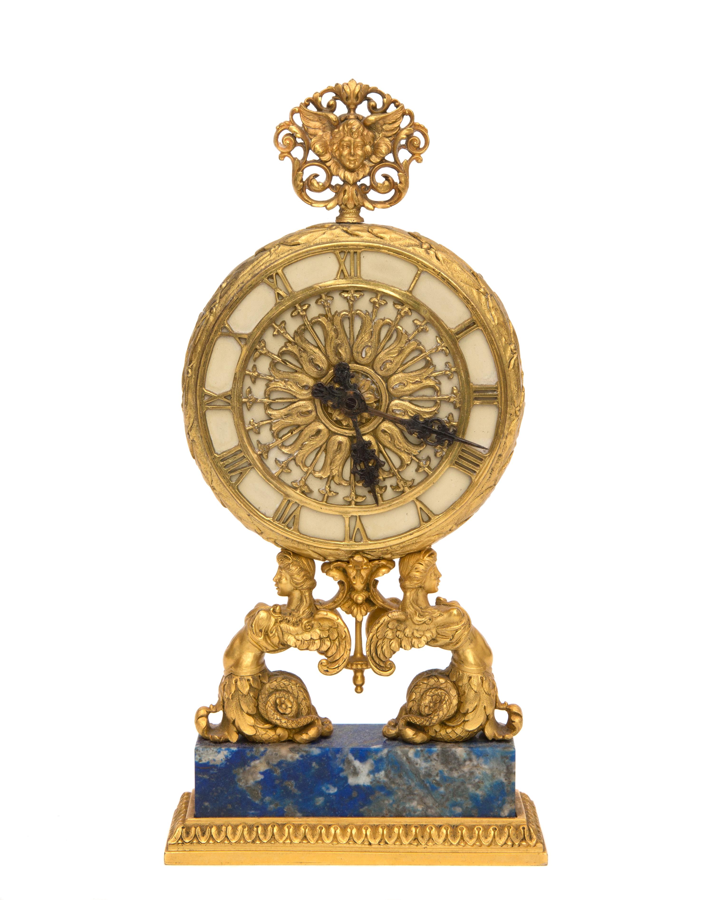 A Continental Gilt Bronze Table Clock Height 8 inches. — RETAILED BY E. F. CALDWELL, NEW YORK